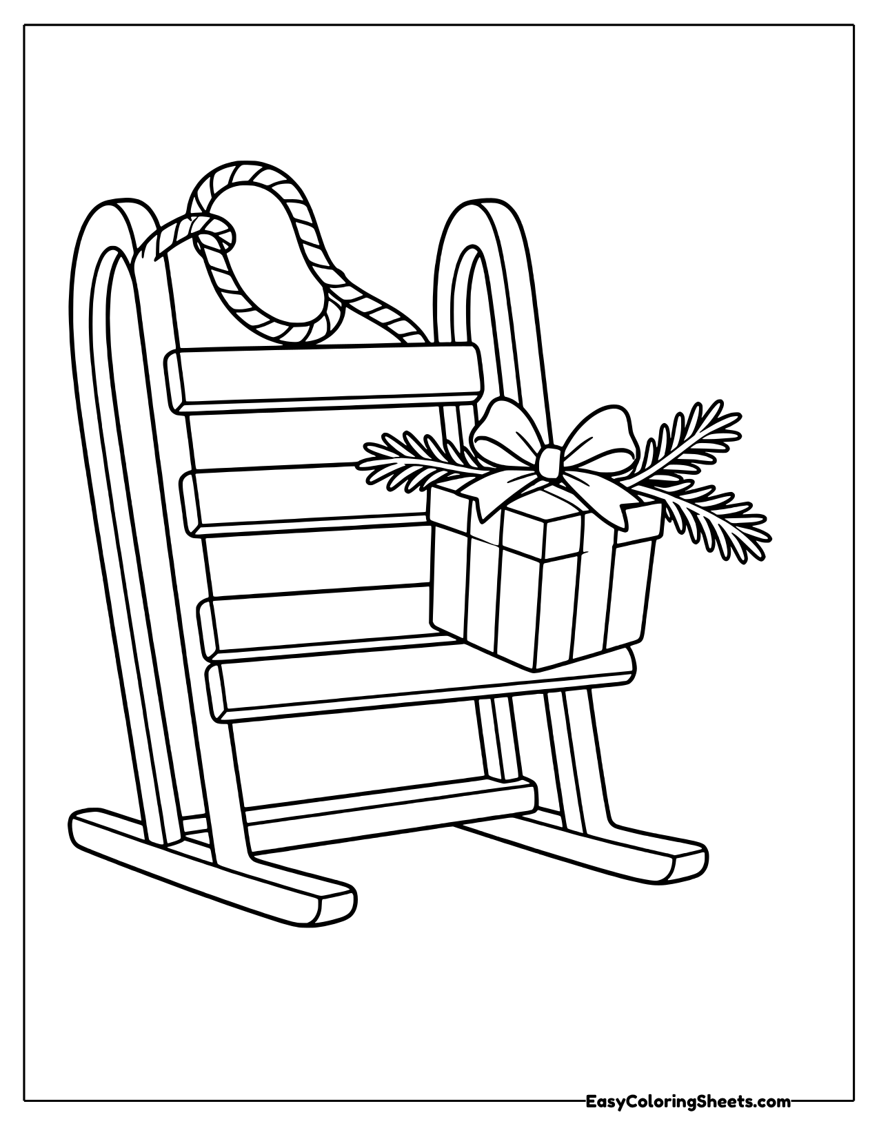 Upright sled with a wrapped gift and pine branches