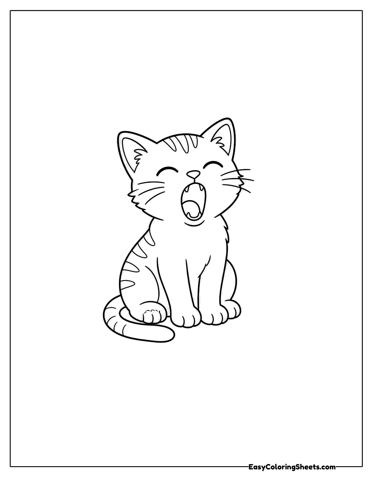 Tabby kitten letting out a big yawn