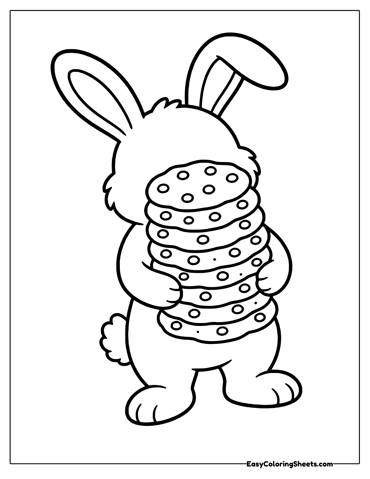 Bunny standing upright holding a tall stack of chocolate chip cookies