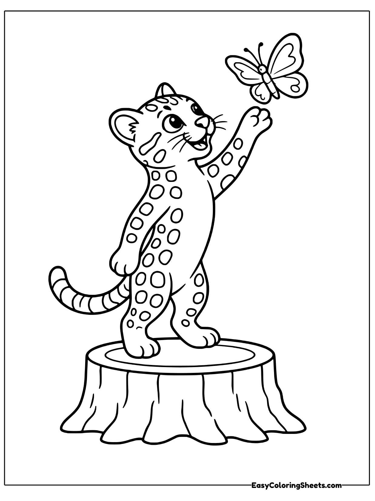 A spotted ocelot stands on its back legs on a tree stump and reaches up toward a butterfly.