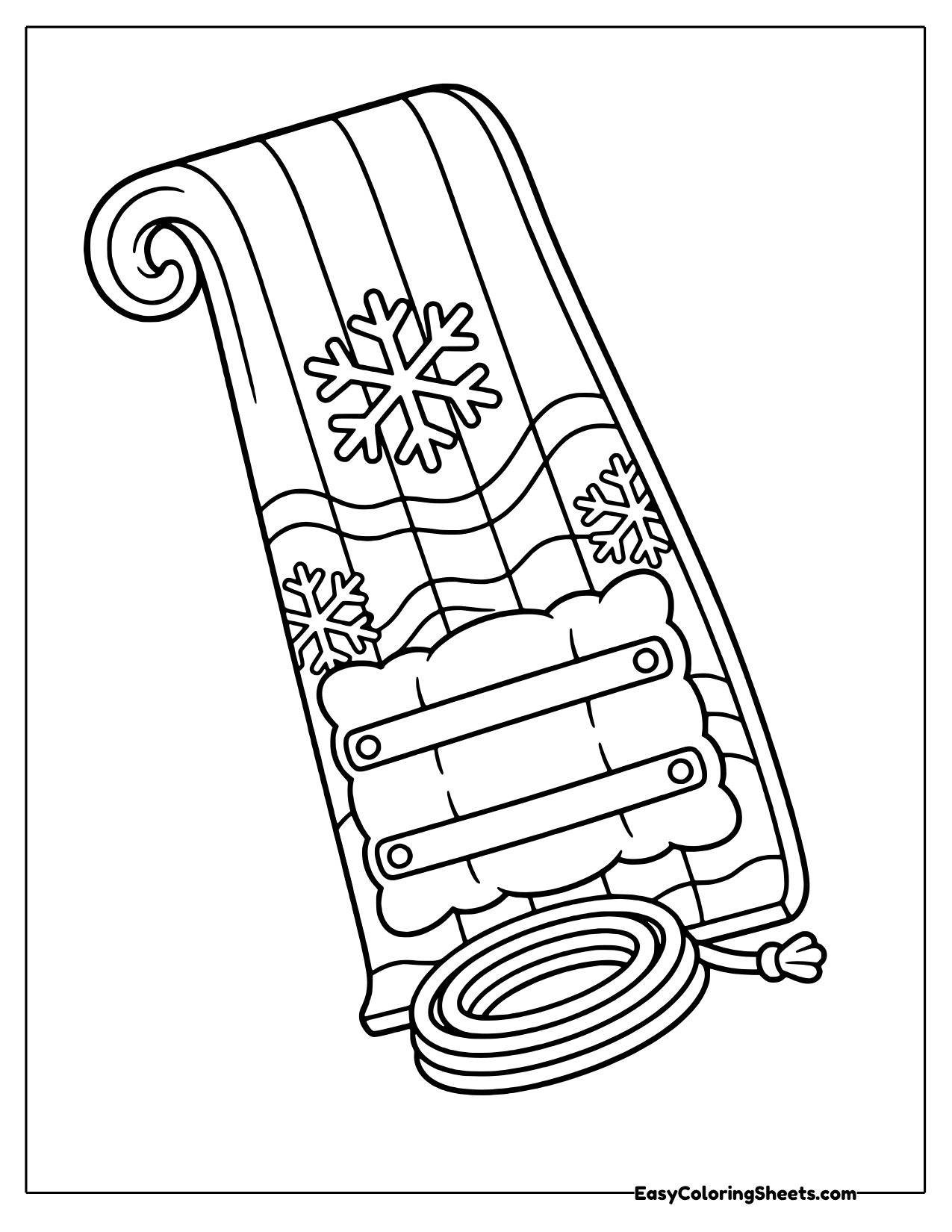 Toboggan with a snowflake cushion and coiled rope