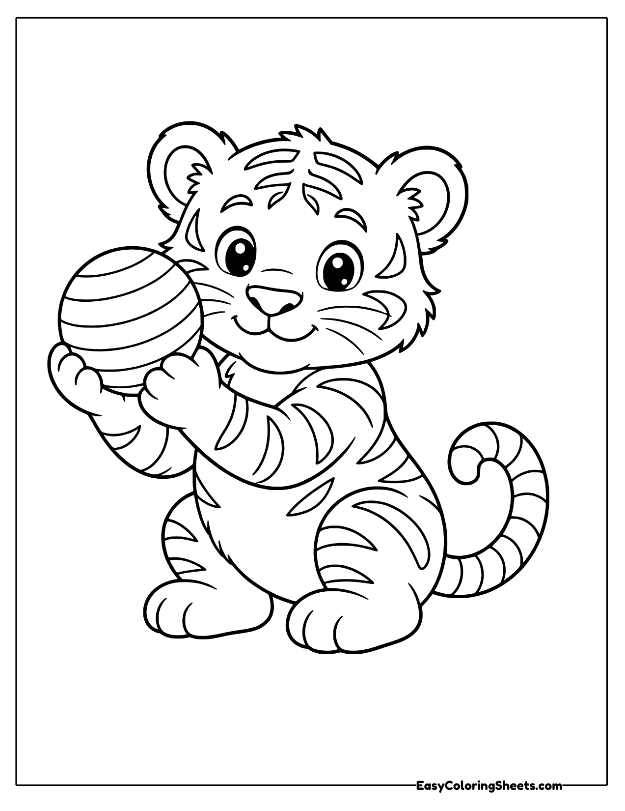 Tiger cub playing with a striped ball