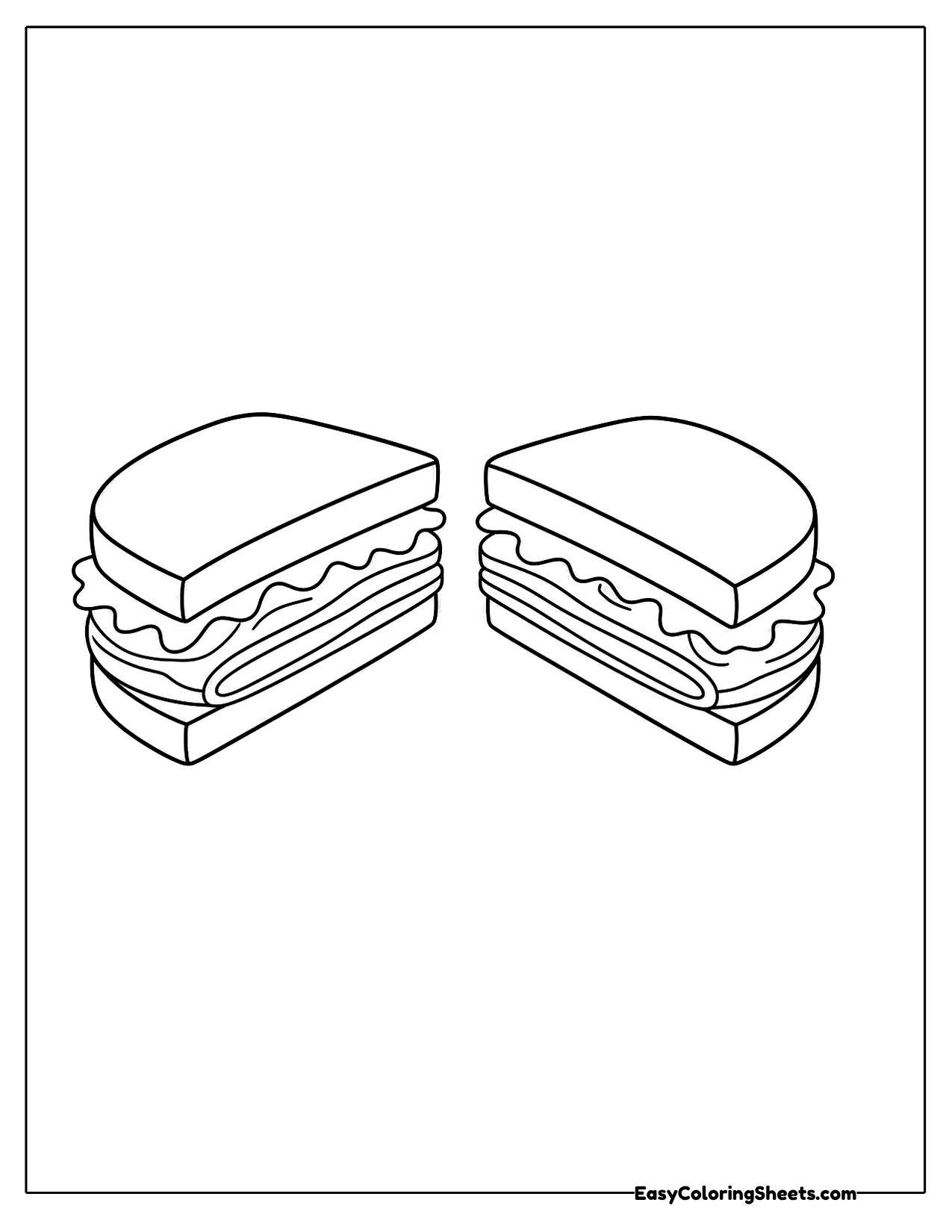 Two halves of a layered turkey sandwich