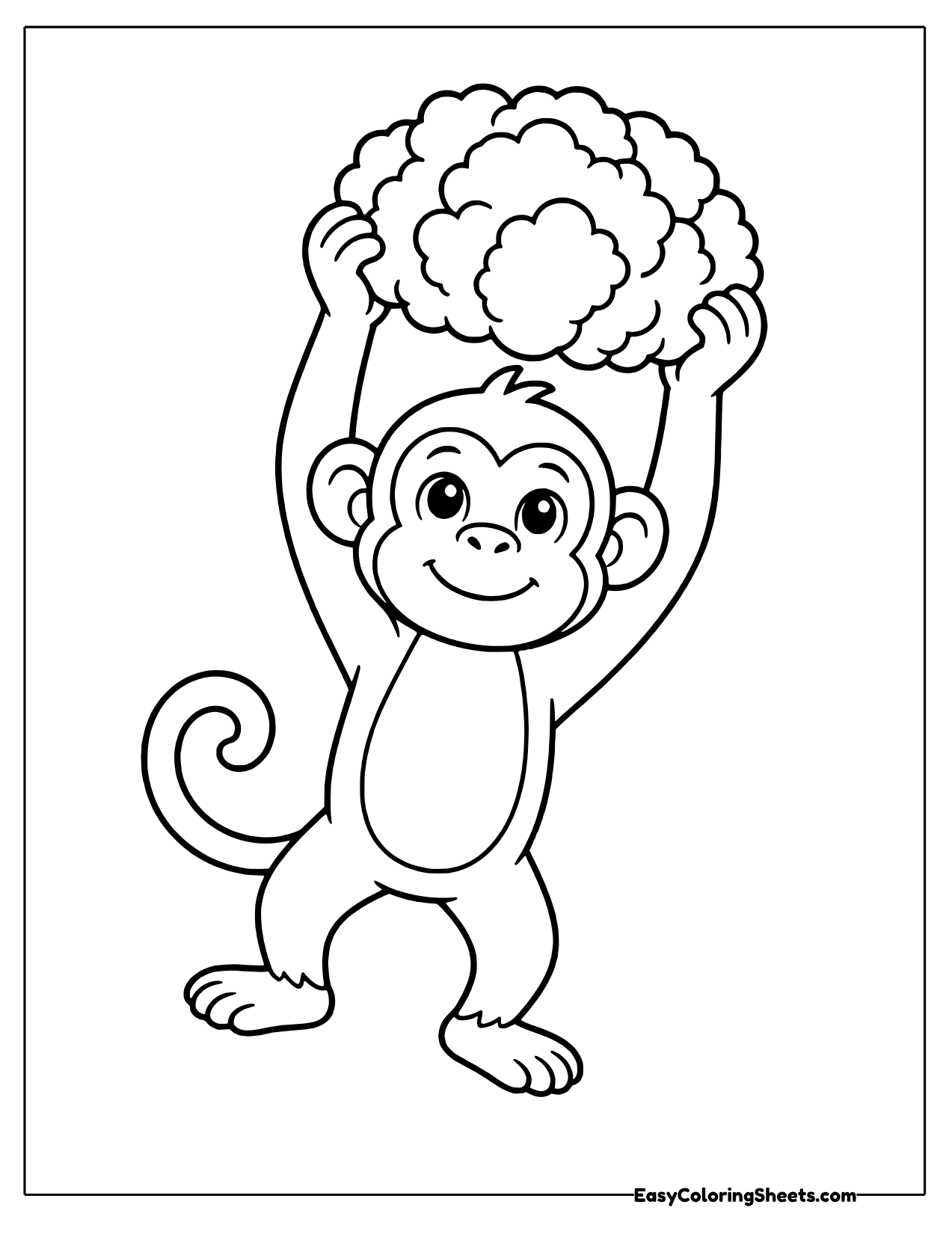 Smiling monkey lifting a bumpy cauliflower overhead