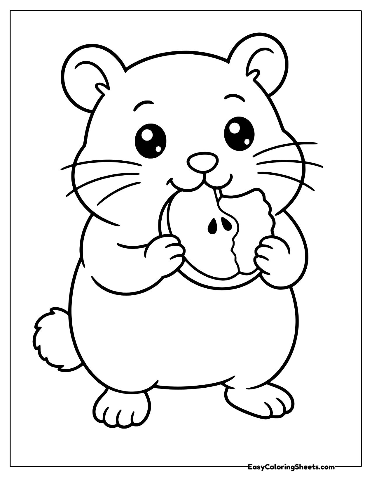 Hamster nibbling a slice of apple