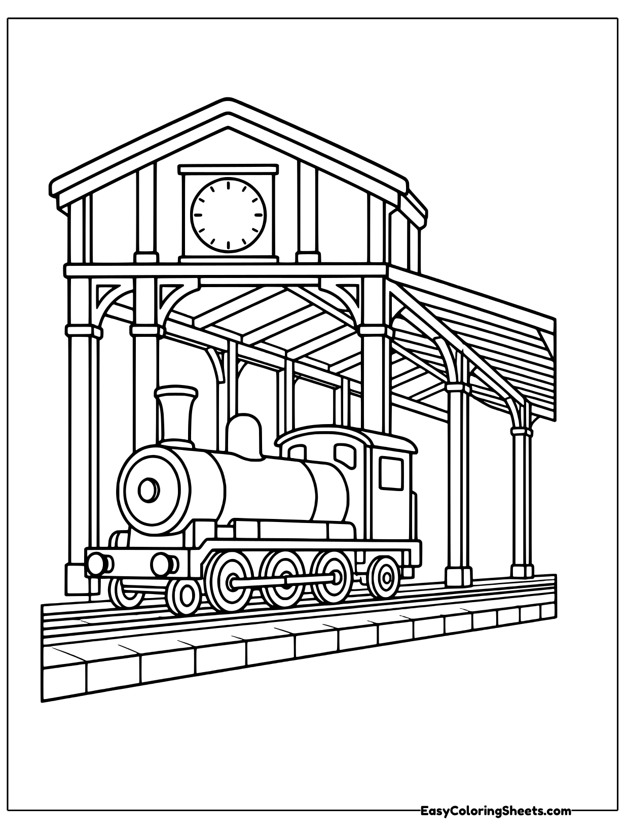 A steam train waits at a covered station platform with a clock on the building above.