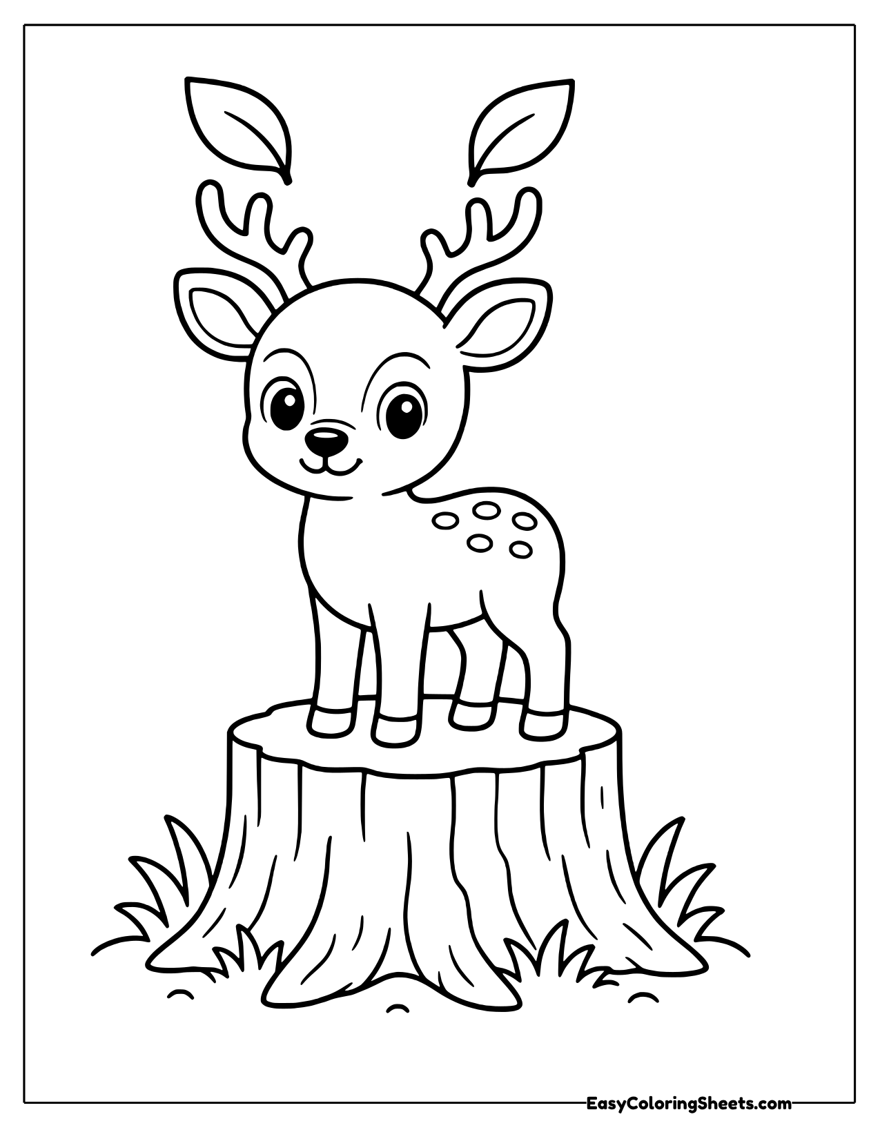 Young deer standing on a tree stump