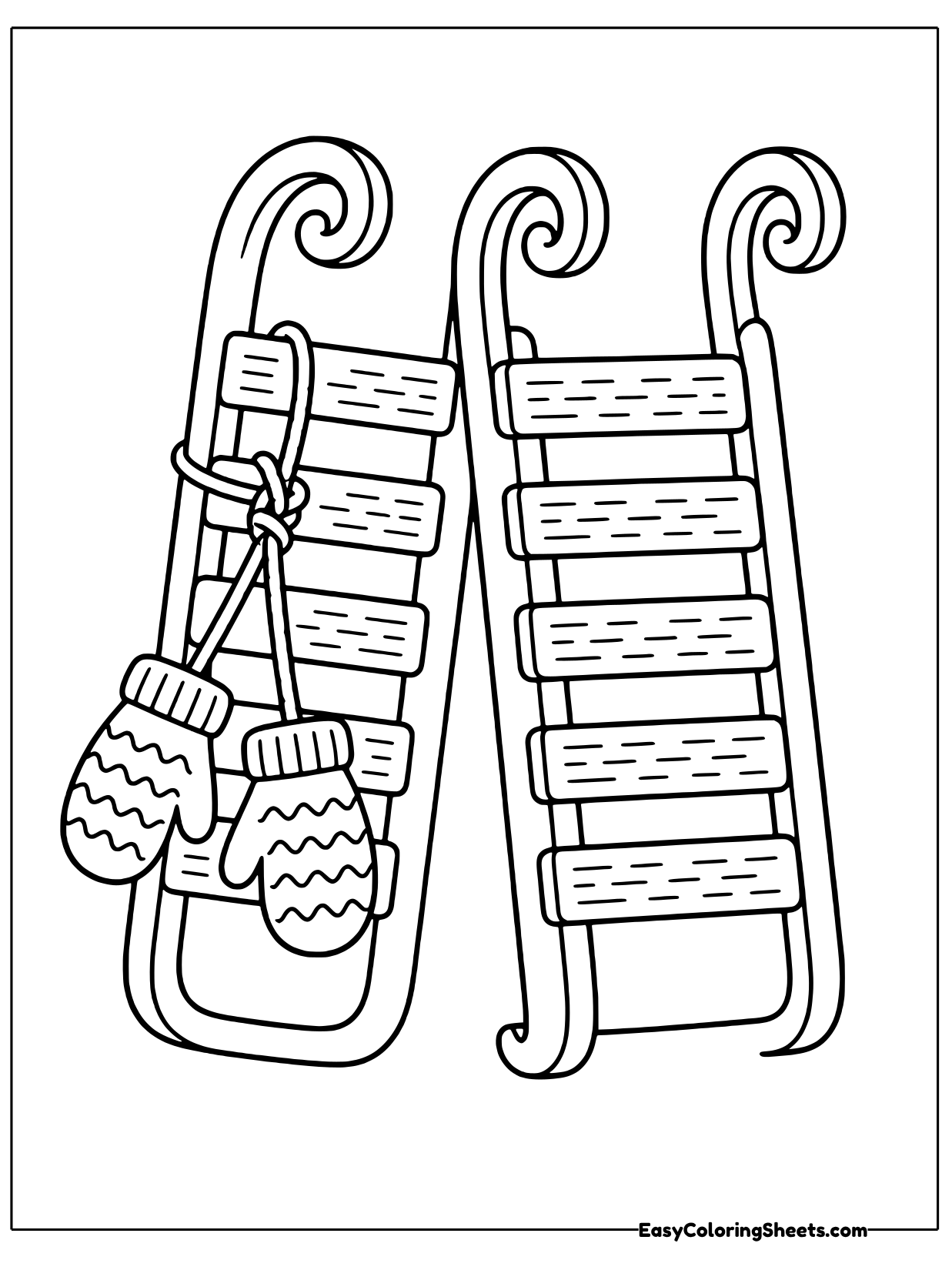 Two upright sleds stand together, and a pair of knitted mittens hangs from one of them.