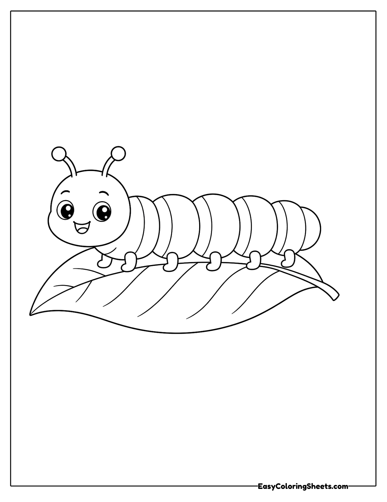 Caterpillar resting on a large leaf