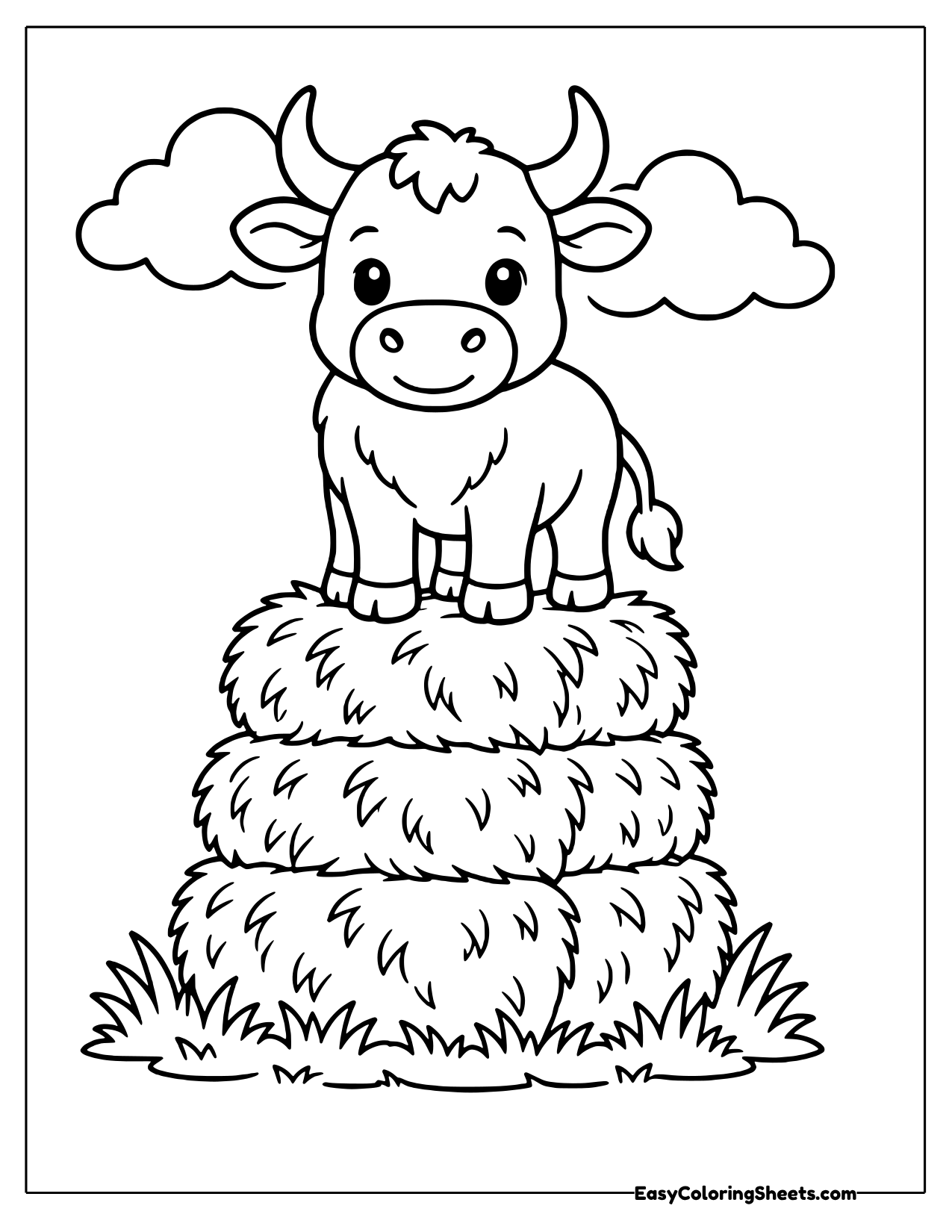 Bull on top of a stack of hay bales