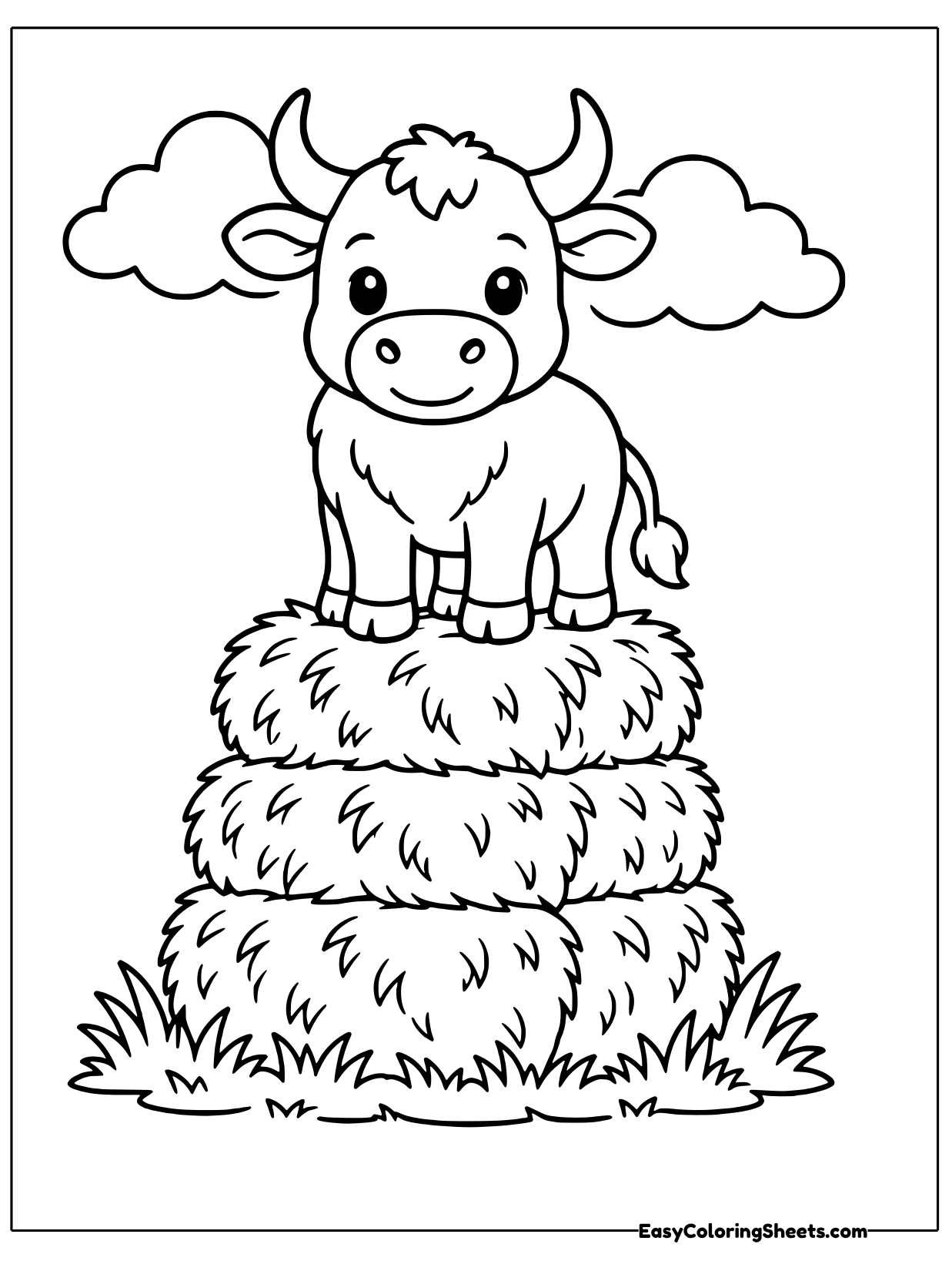 A cute bull stands proudly on top of a tall stack of round hay bales, with clouds floating above.