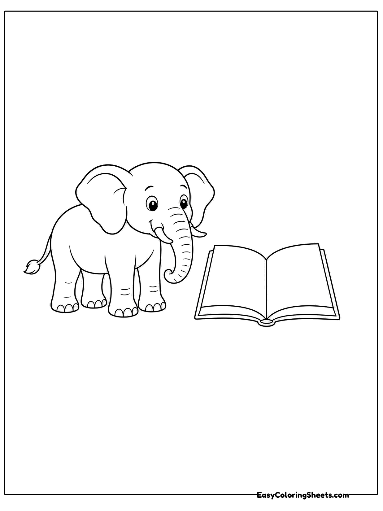 A small elephant stands next to an open book lying on the ground.
