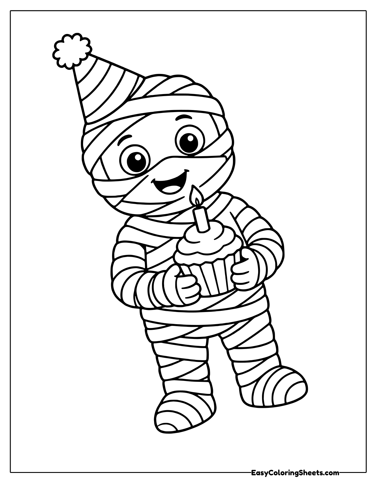 A mummy wearing a pointed party hat holds a cupcake with a candle.