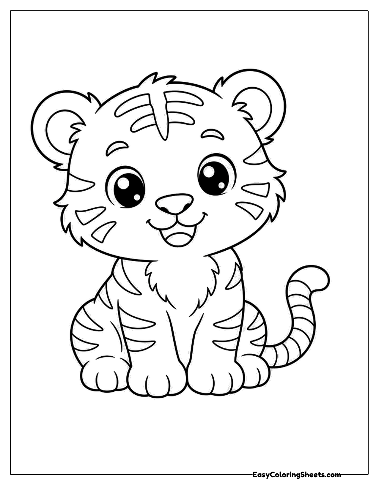 Baby tiger cub sitting with a sweet smile