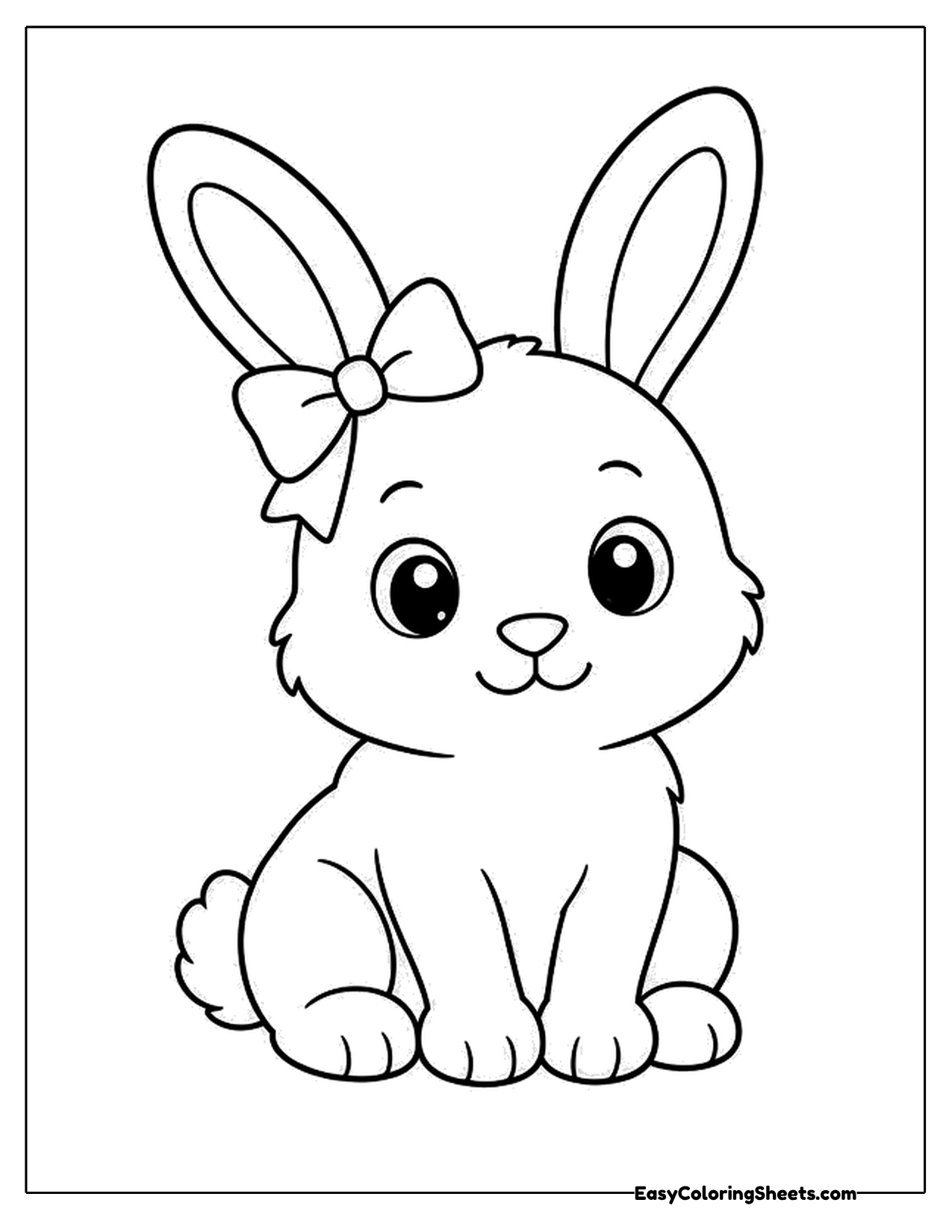 Bunny with a bow on its head sitting and facing forward