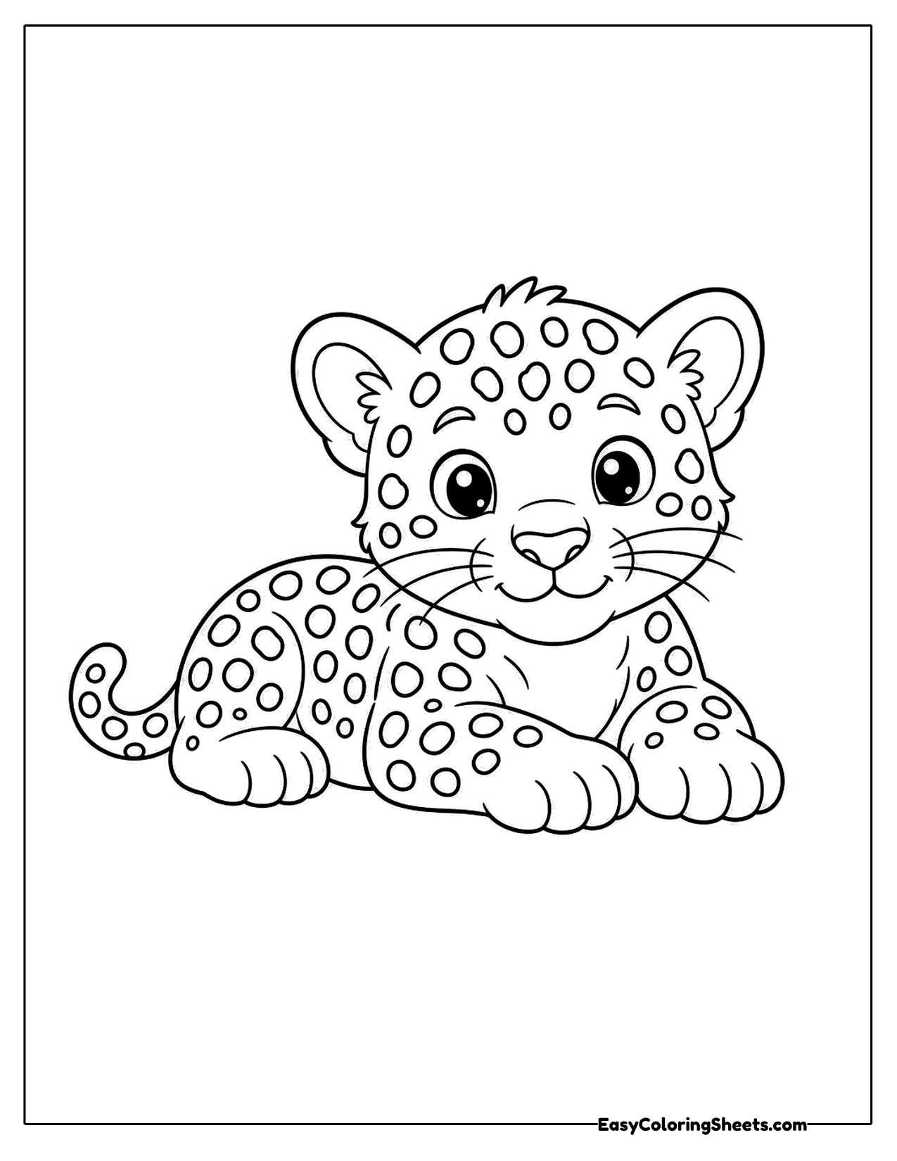 Young jaguar lying down with a spotted coat