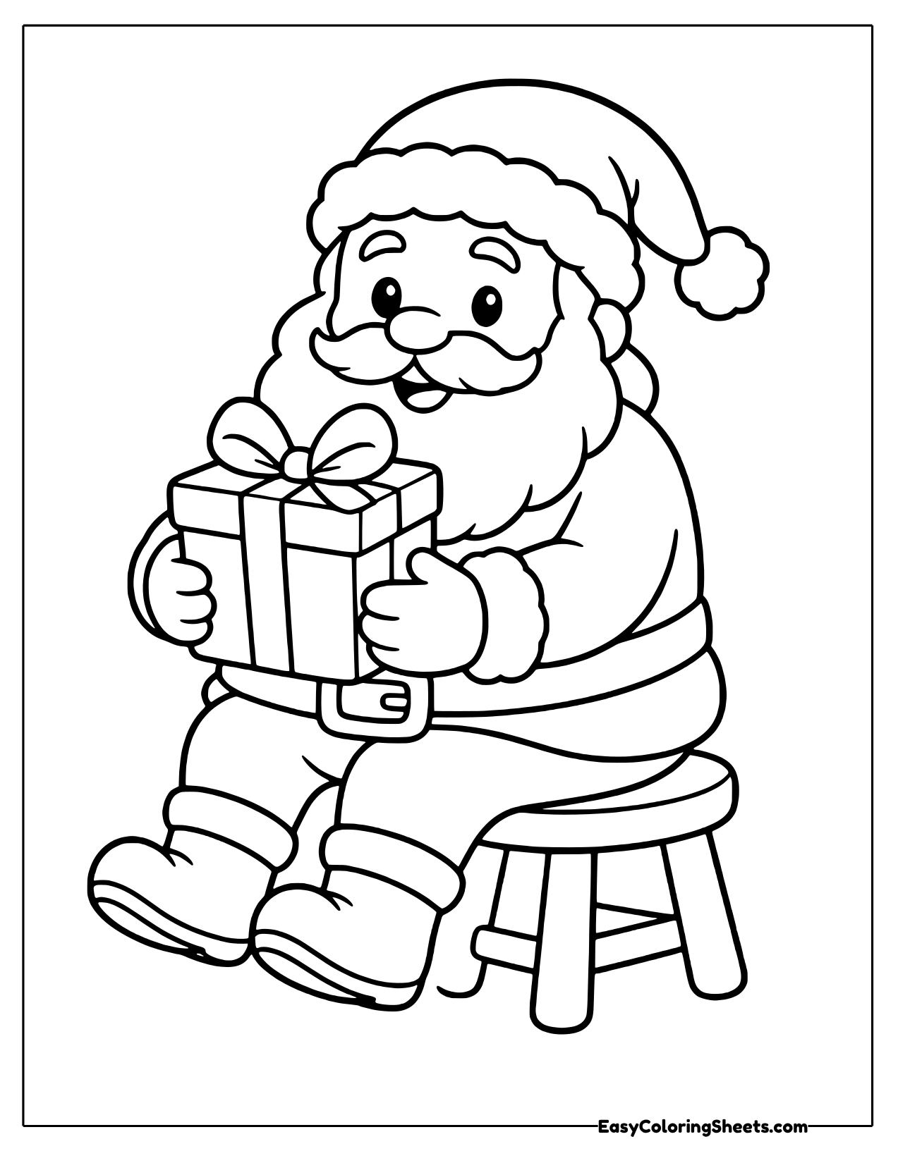 Santa seated on a stool holding a gift