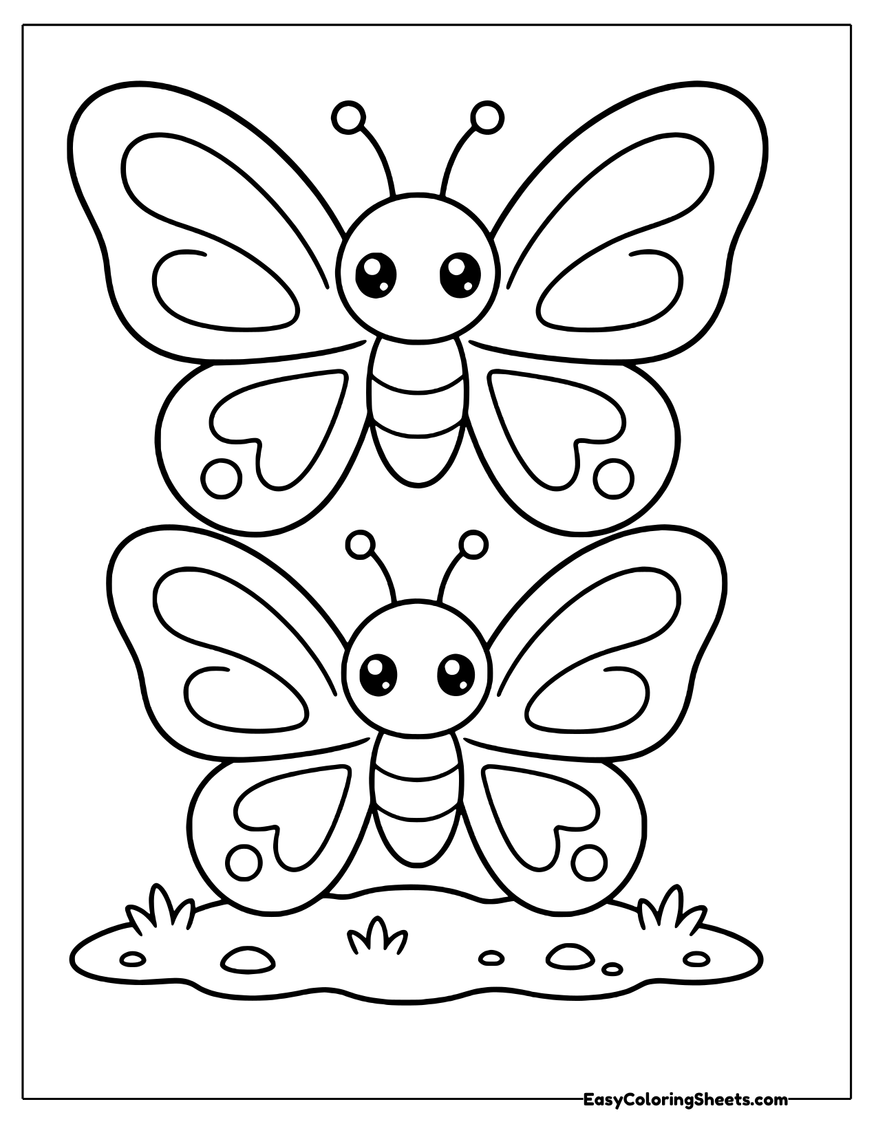 Two butterflies stacked on a grassy mound