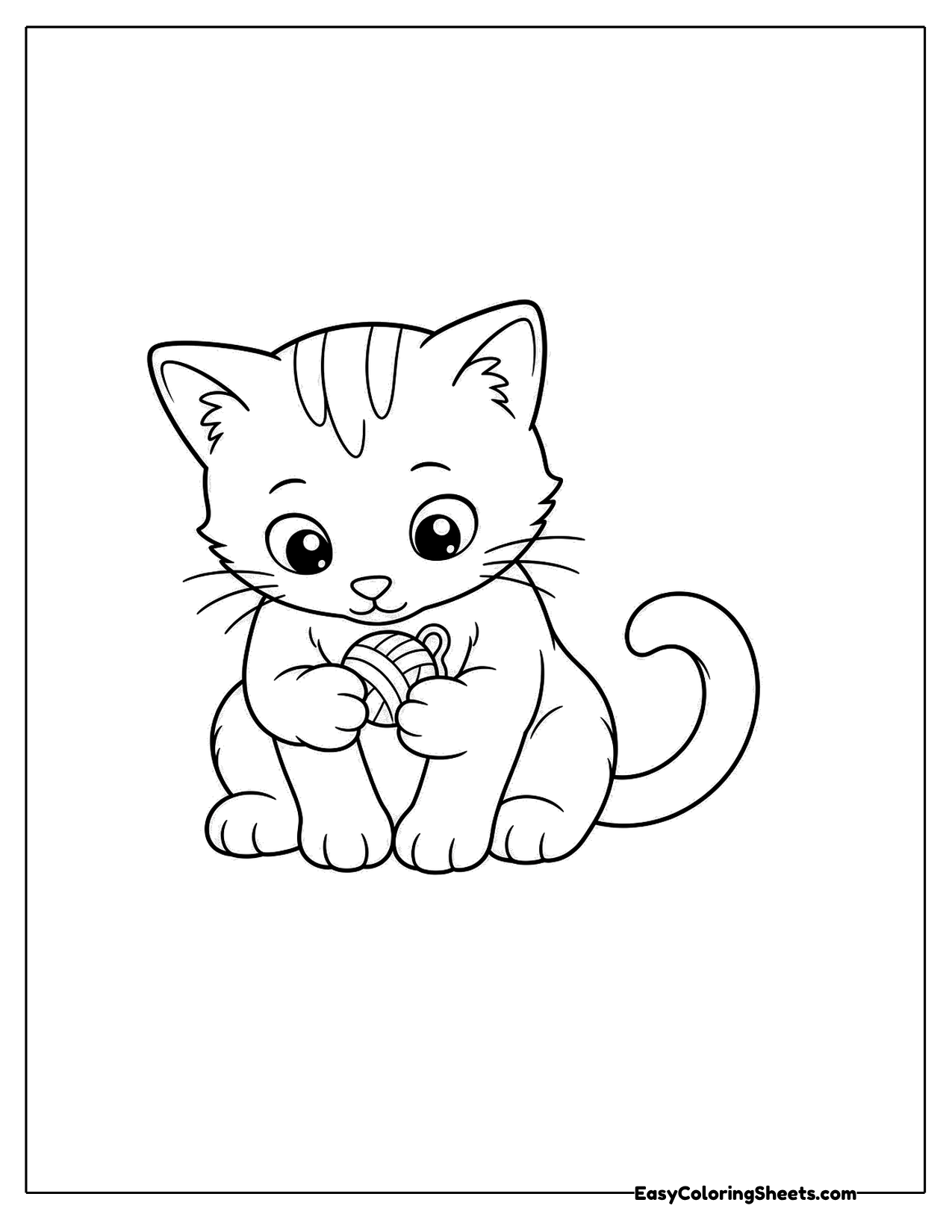 Striped kitten playing with a ball of yarn