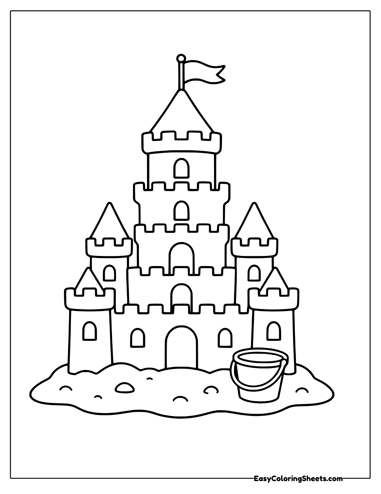 Tall sandcastle with many towers and a flag