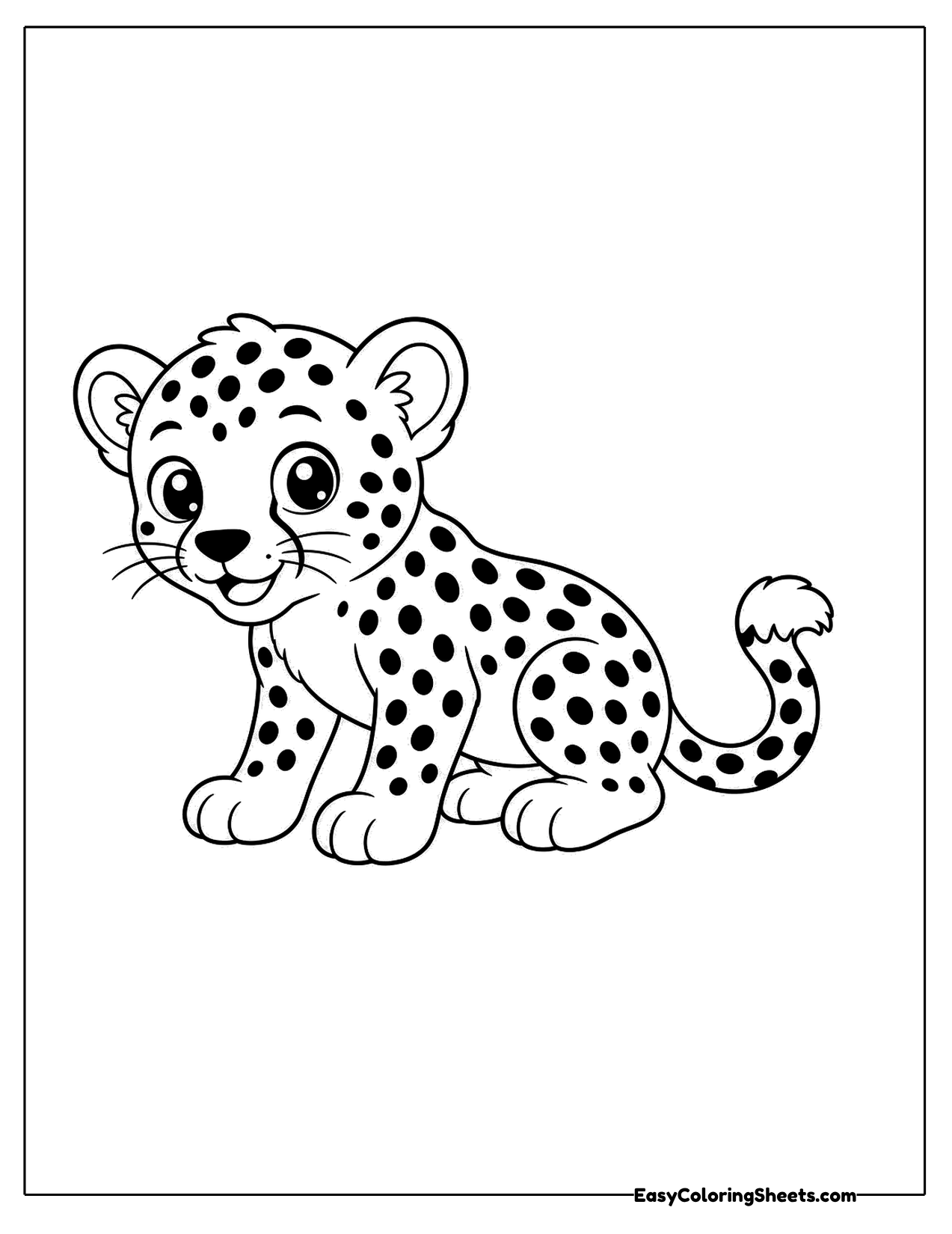 Spotted baby cheetah cub sitting