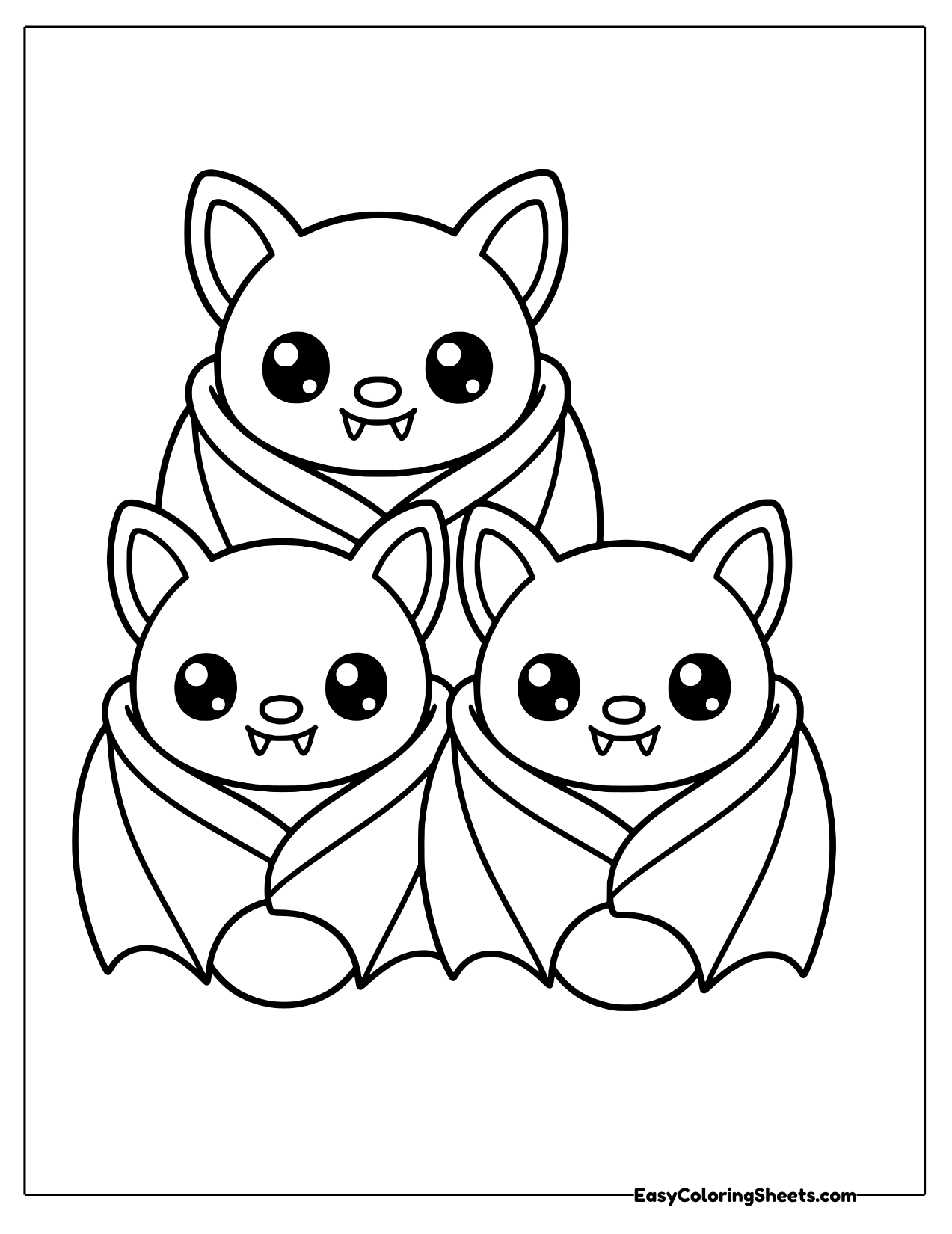 Three bats huddled together wrapped in wings