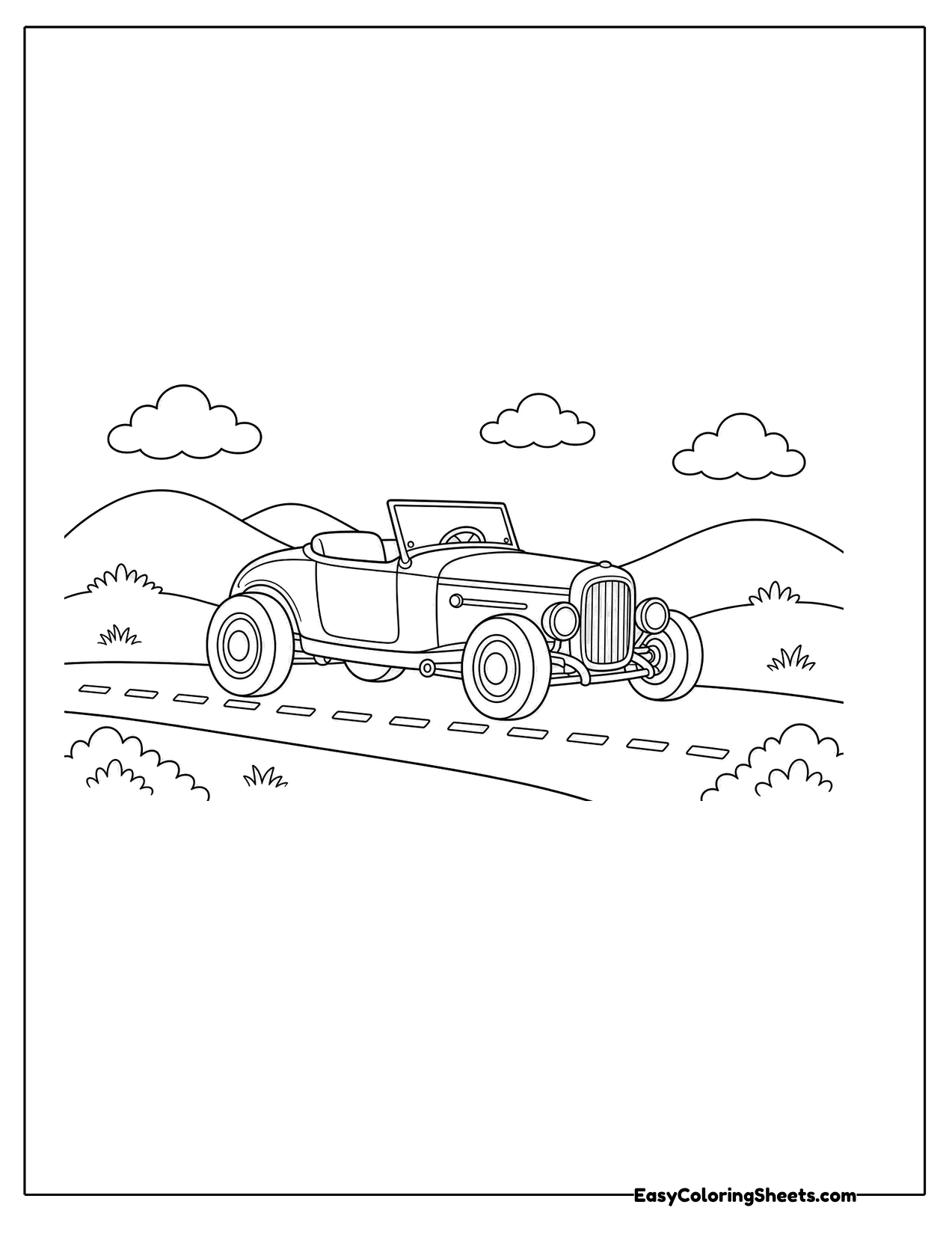 Small open top hot rod driving on a country road