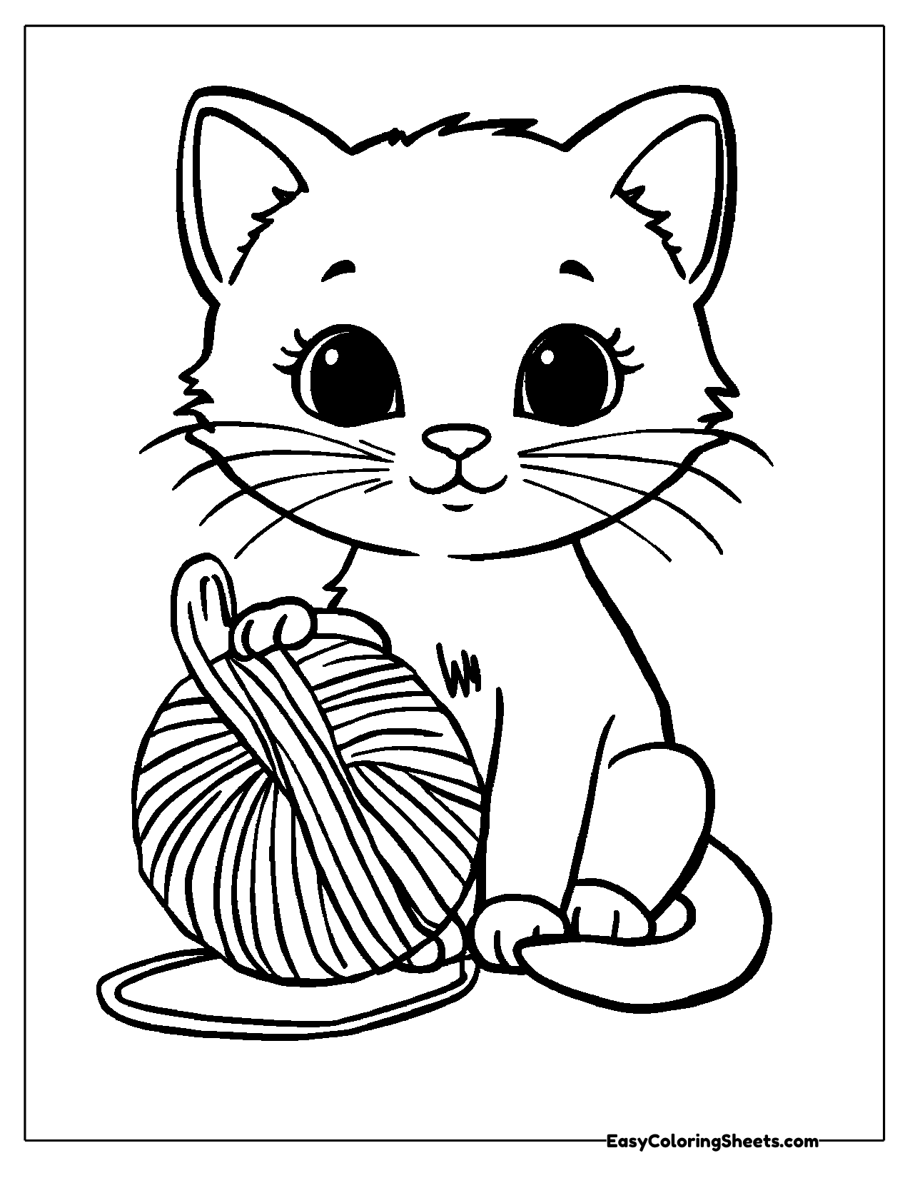Big eyed cat sitting beside a ball of yarn