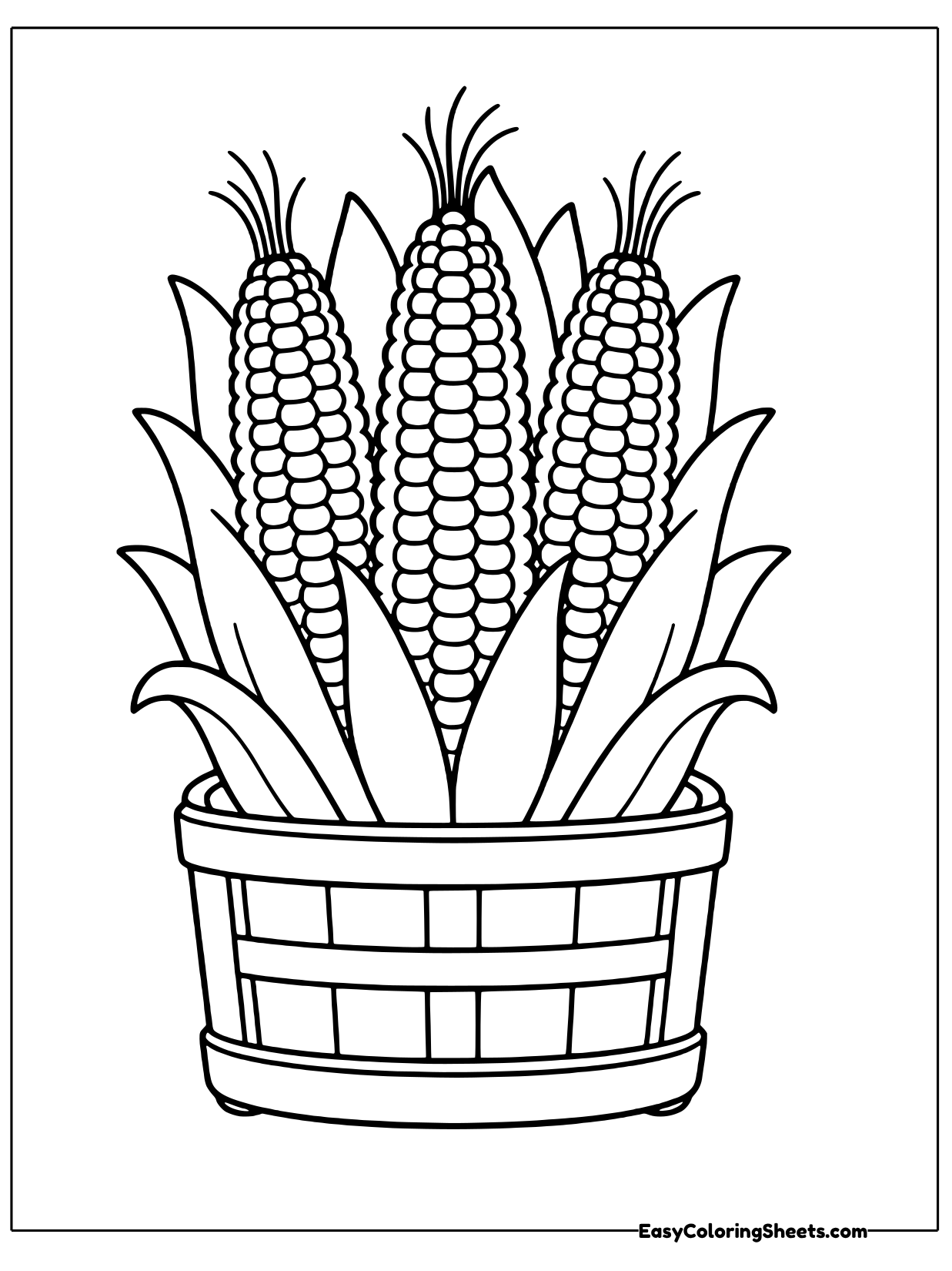 Three ears of corn stand upright in a wooden crate with their green husks curling out over the sides.