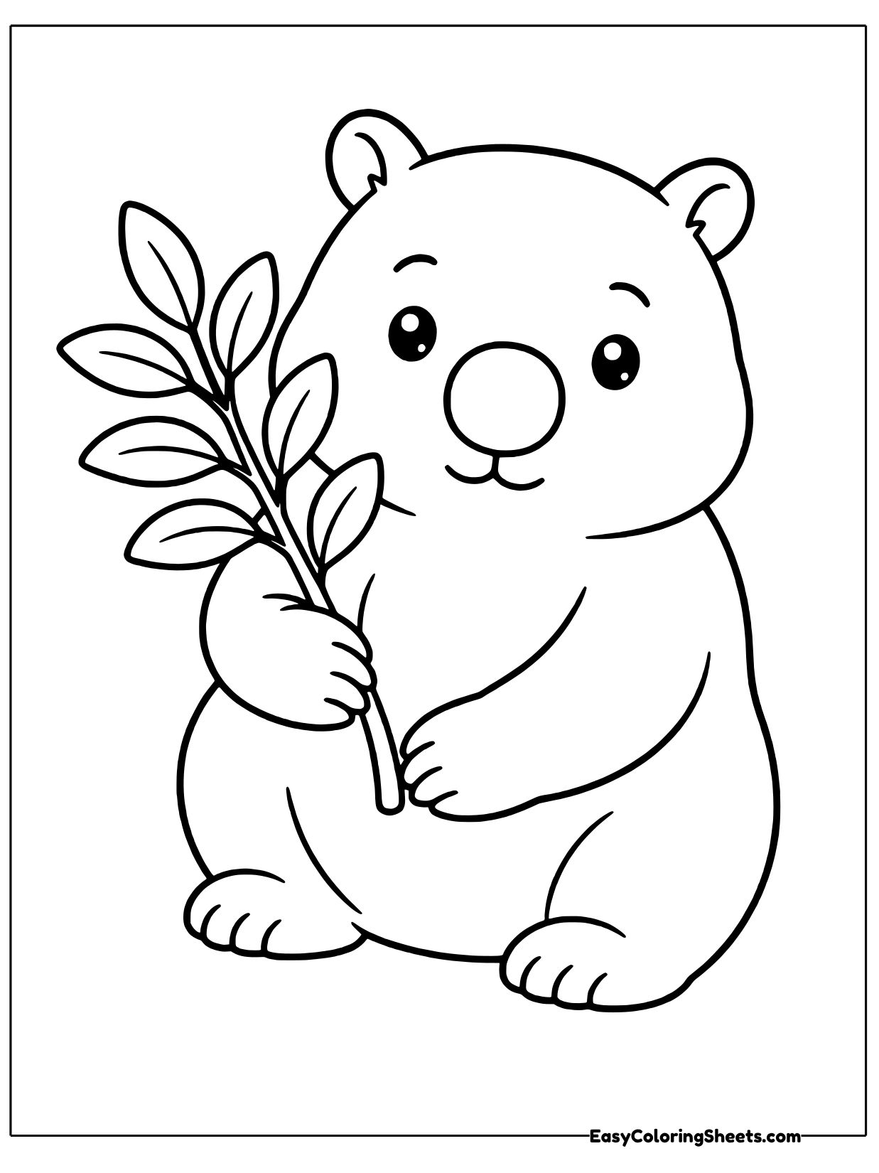A wombat holds a sprig of leaves.