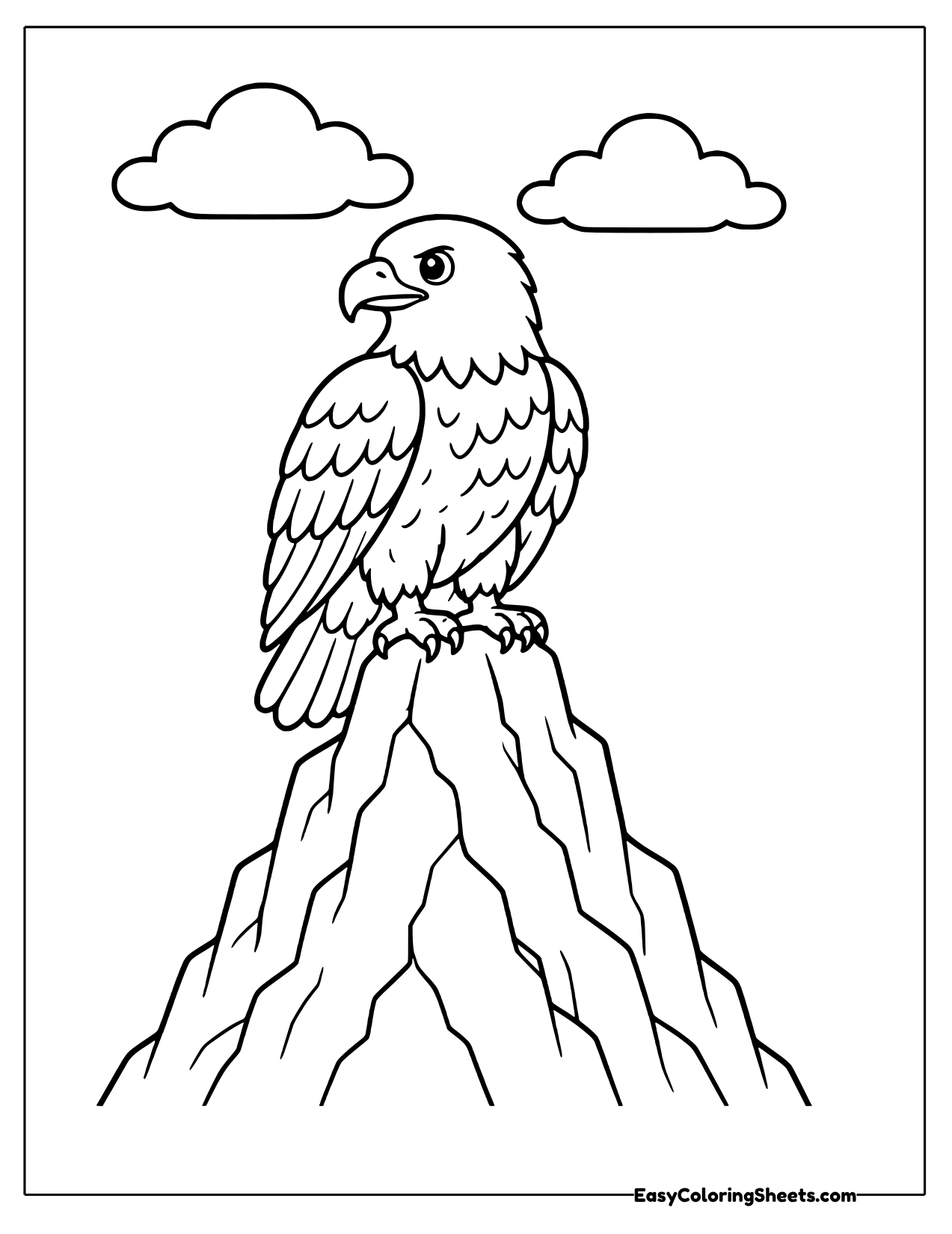 Bald eagle on a mountain peak