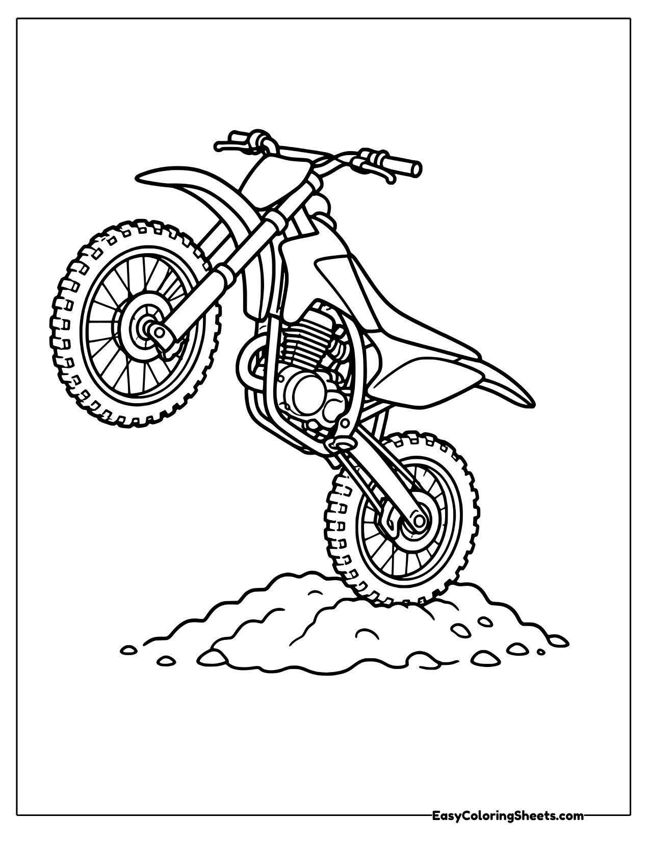 Dirt bike popping a wheelie over dirt
