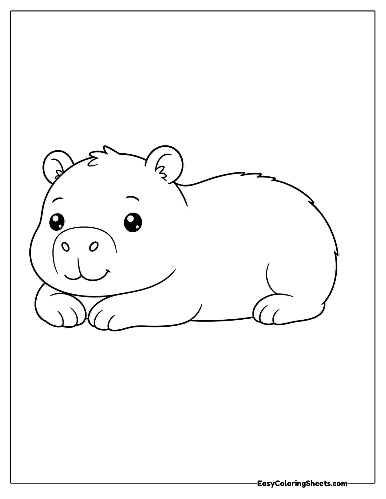 Resting capybara lying on its belly