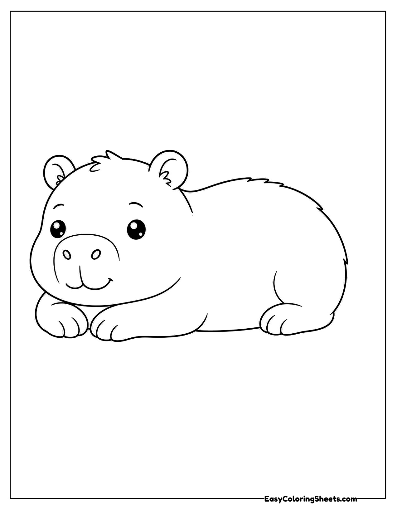 Resting capybara lying on its belly