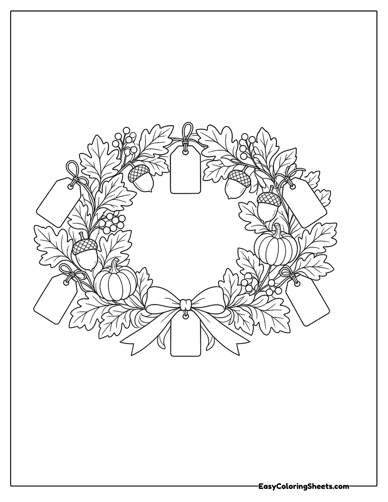 Autumn wreath of leaves, acorns and pumpkins with hanging tags and a bow