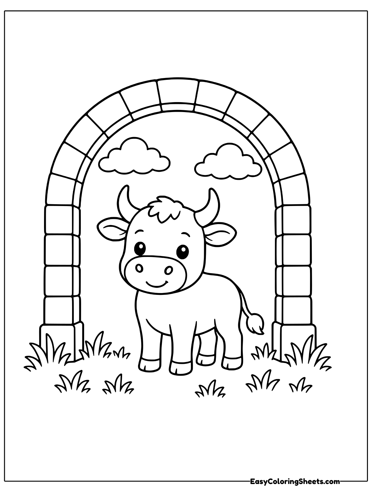 A cute bull stands under a tall brick archway with grass and flowers around its hooves.