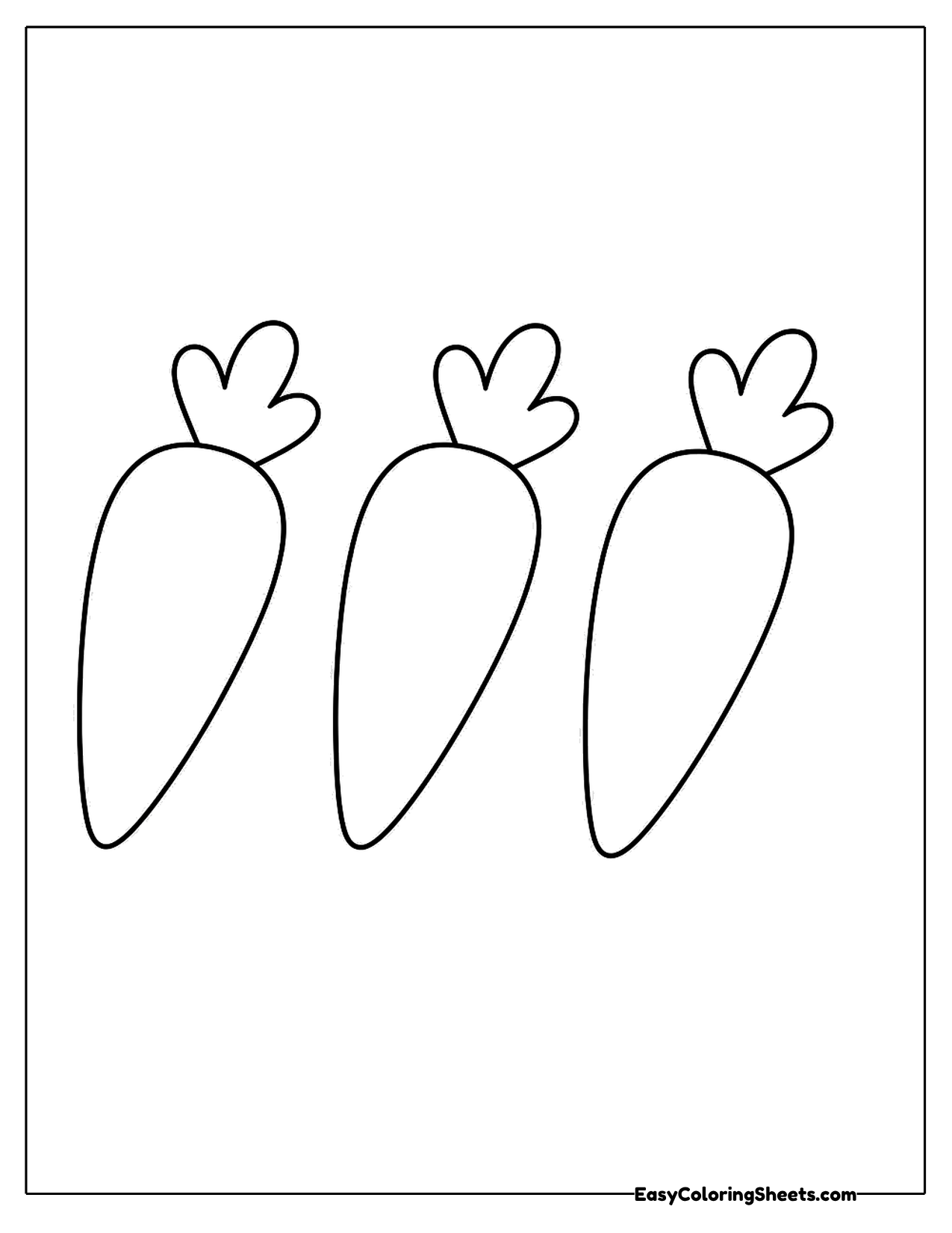 Three carrots with leafy tops in a row