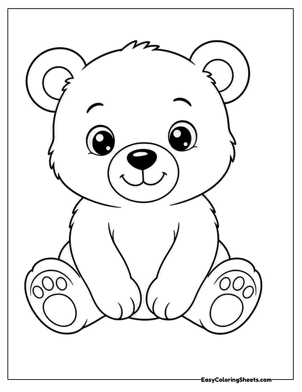 Cute baby bear sitting with feet forward