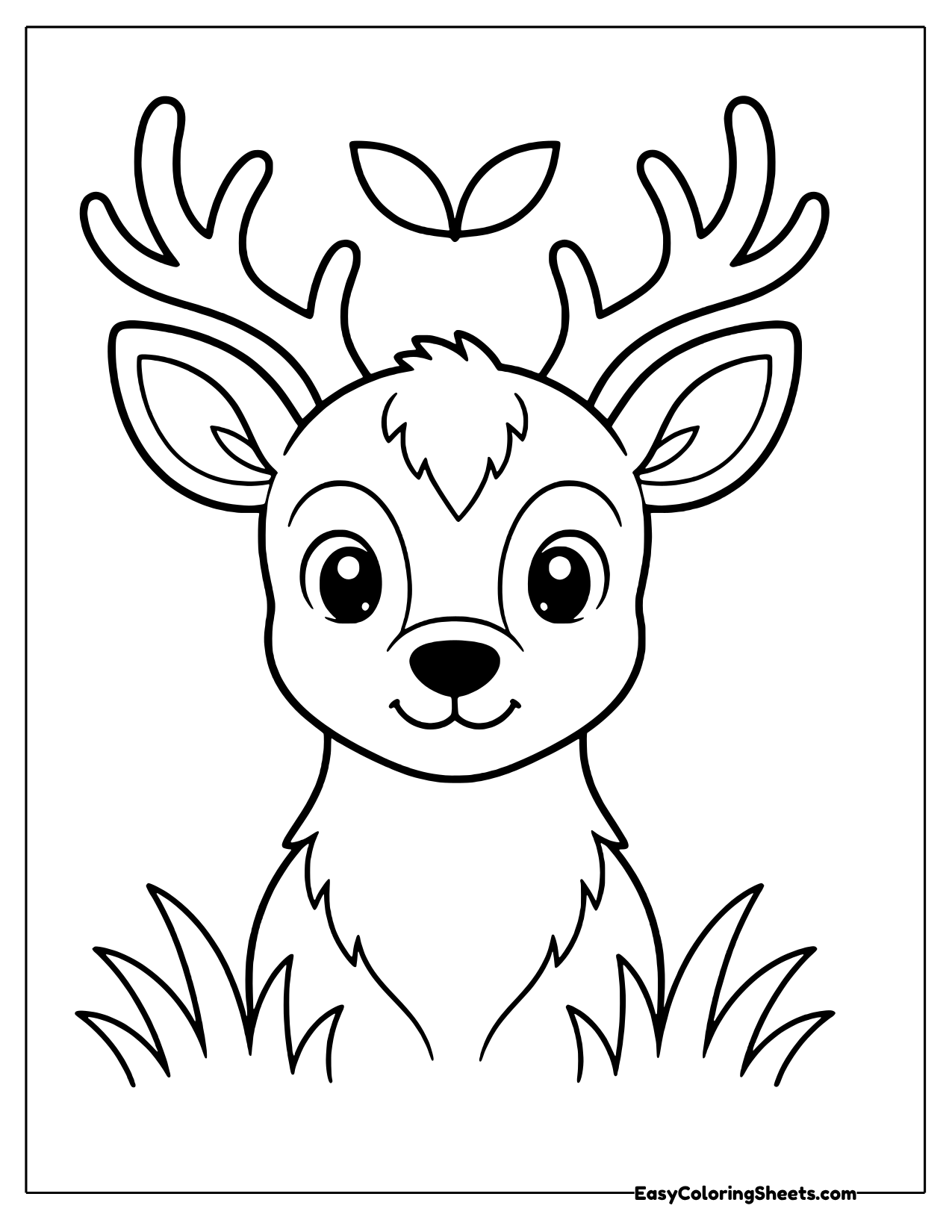 Buck head with antlers above tall grass