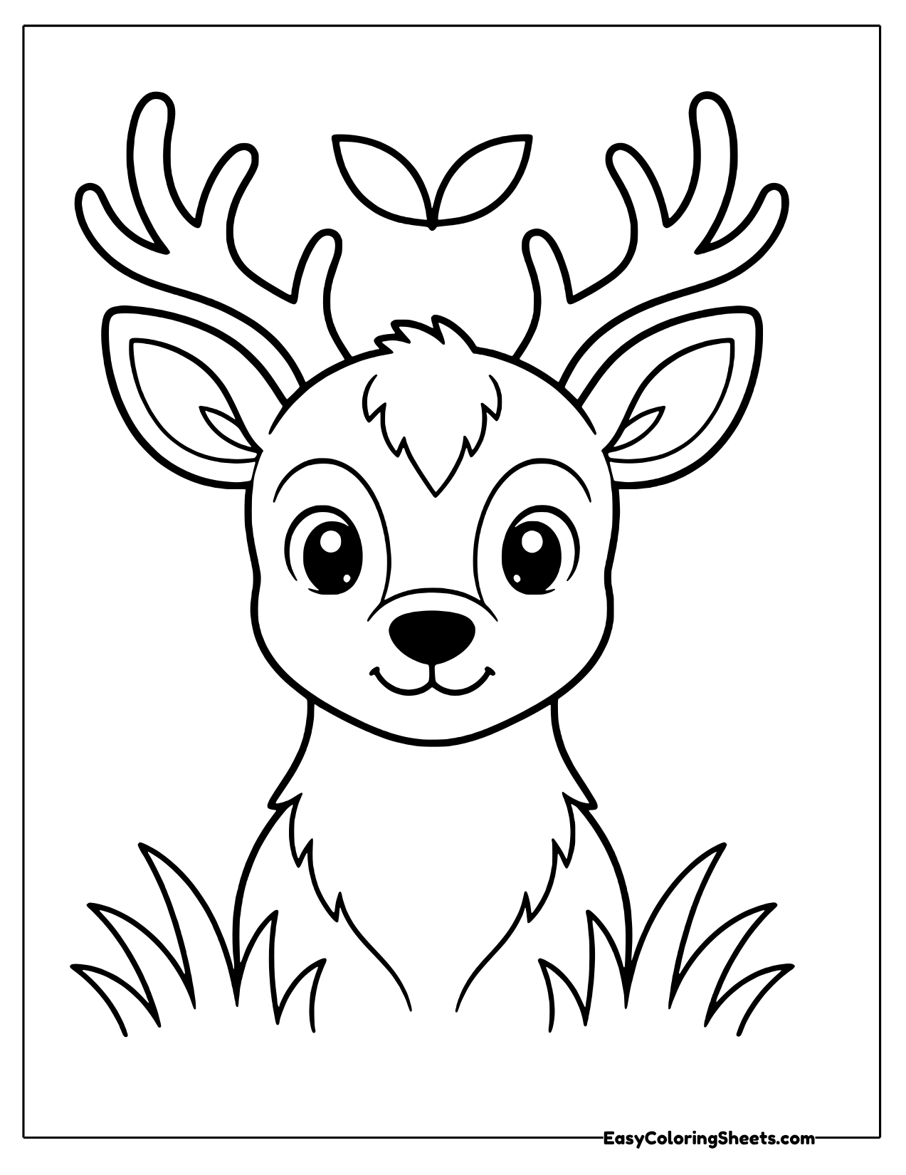 Buck head with antlers above tall grass