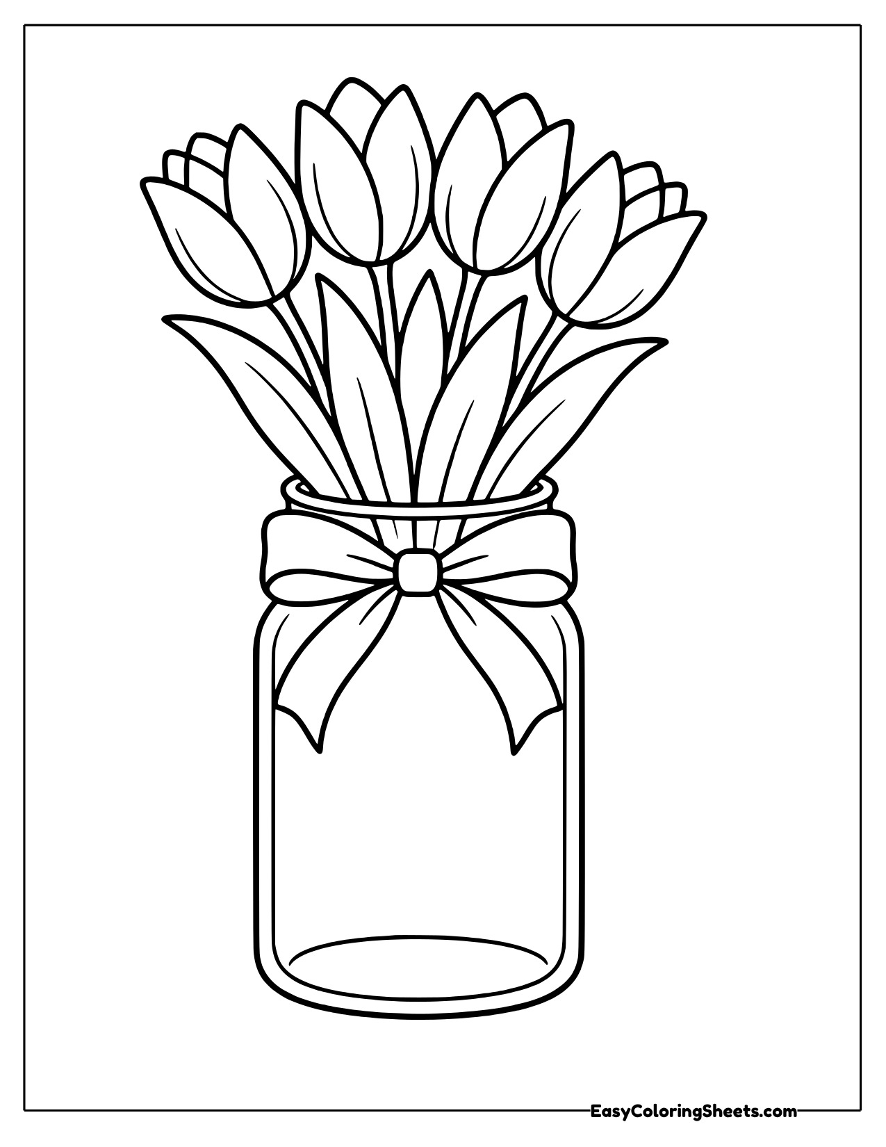 Glass jar of tulips tied with a ribbon
