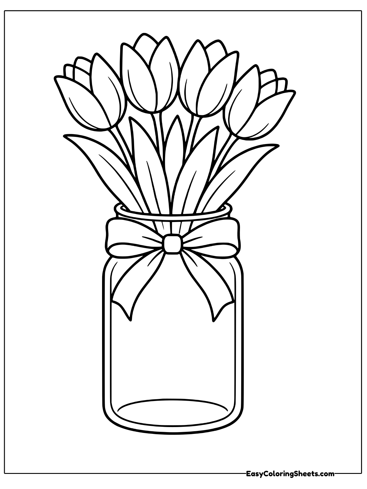 A clear mason jar holds a bundle of tulips with a ribbon bow wrapped around its neck.