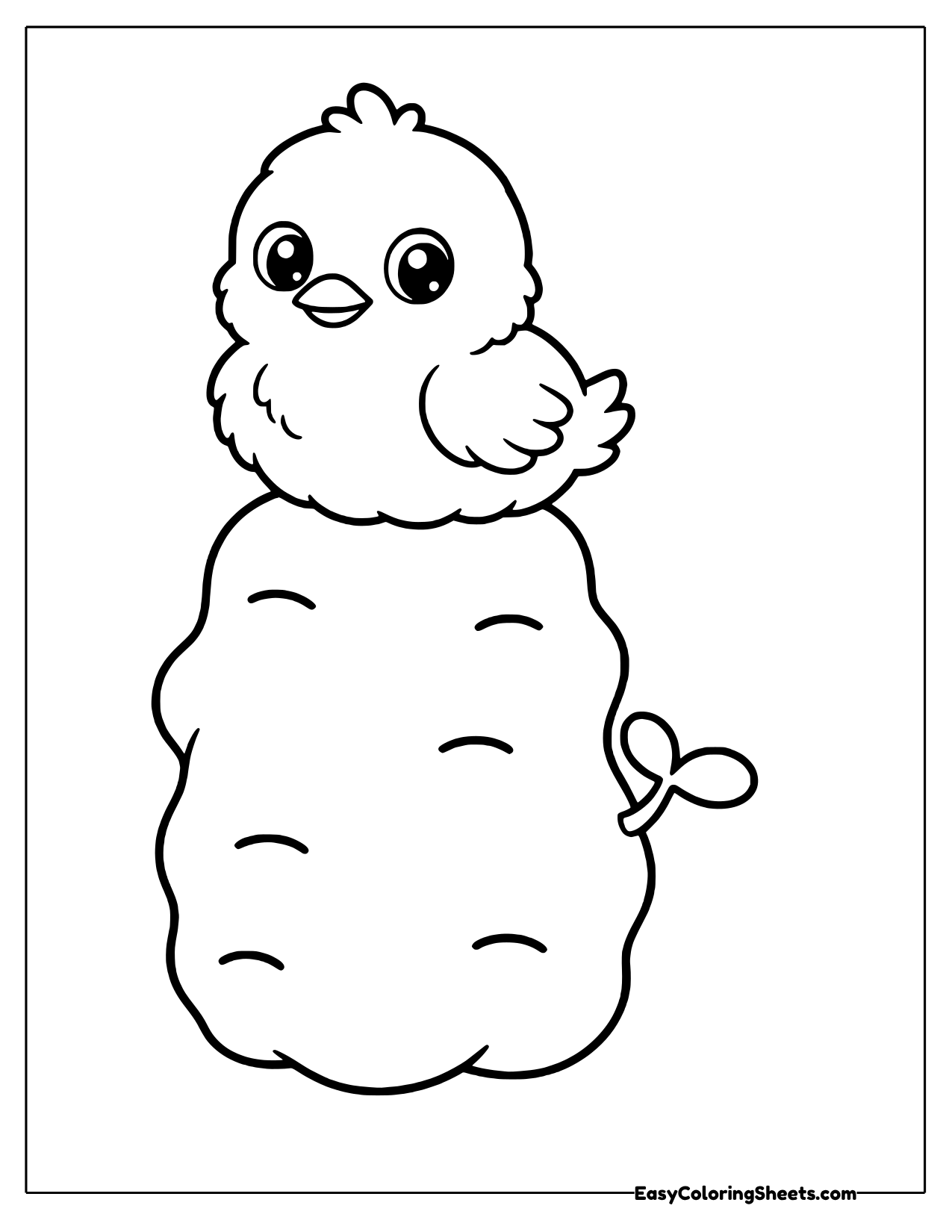 Fluffy baby chick sitting on top of a tall lumpy potato