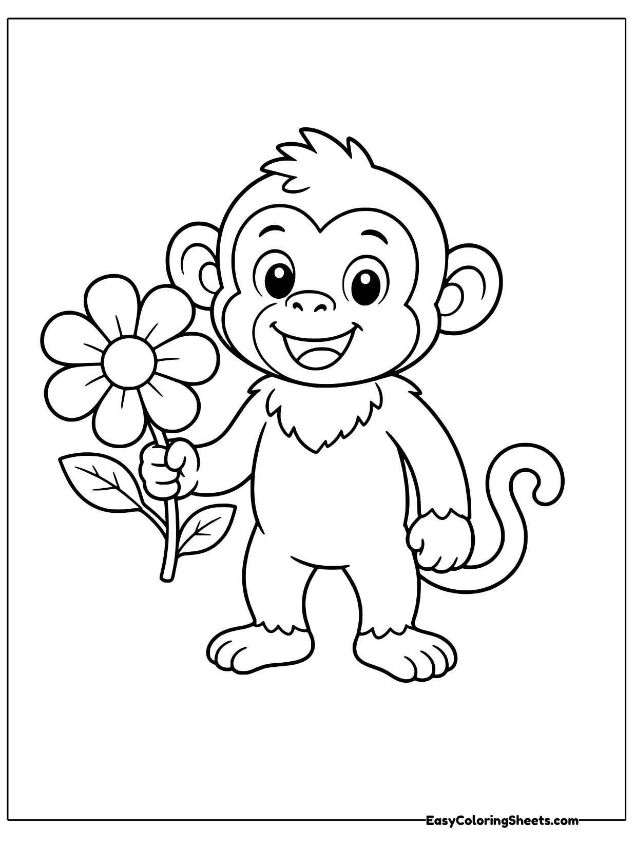 A monkey stands beside a large daisy-like flower and holds its stem.