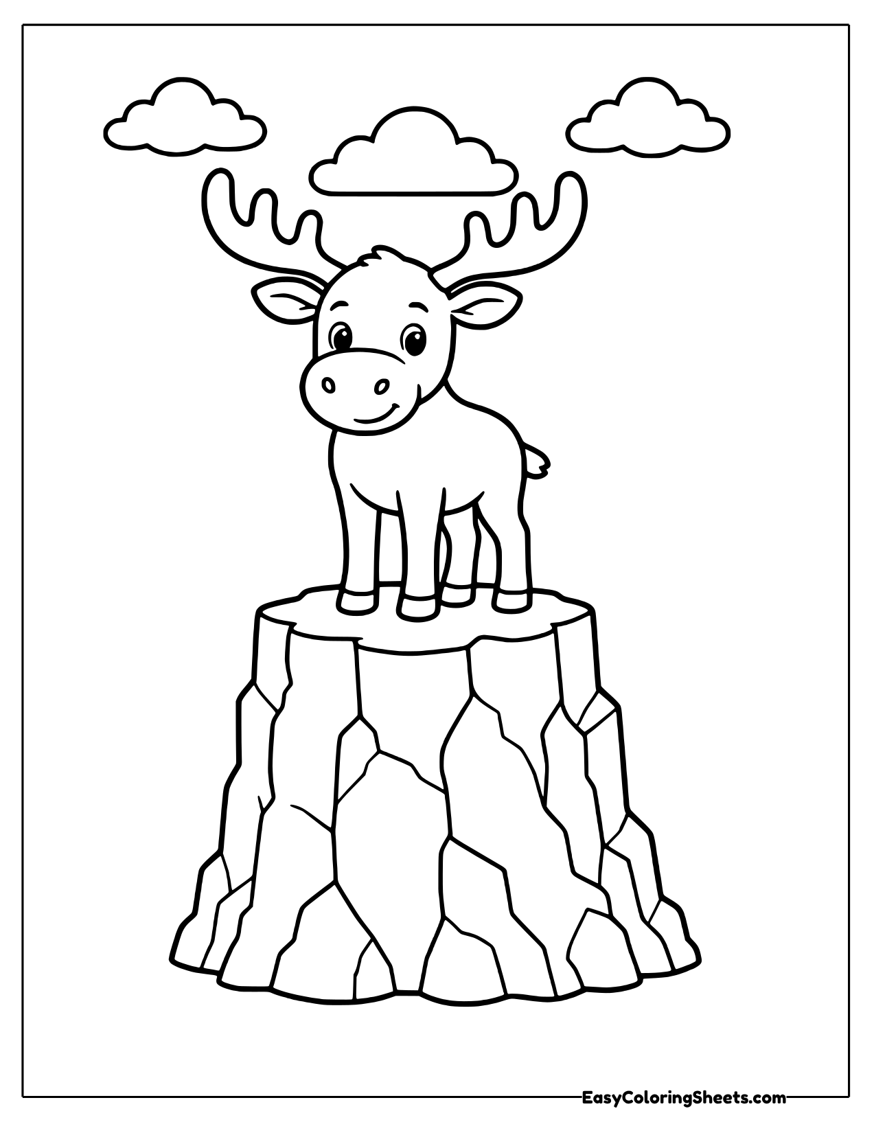 Small moose standing on a rocky pedestal
