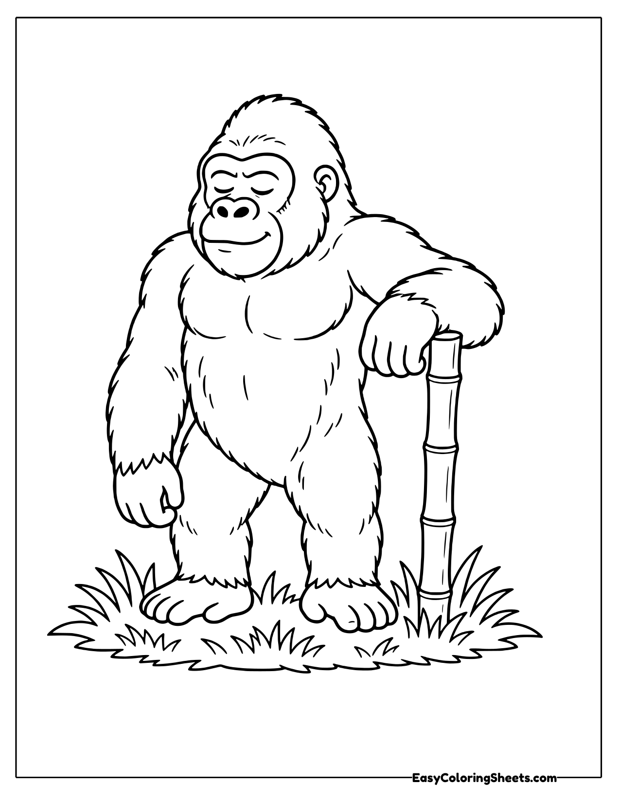 Gorilla standing and leaning on a stalk of bamboo