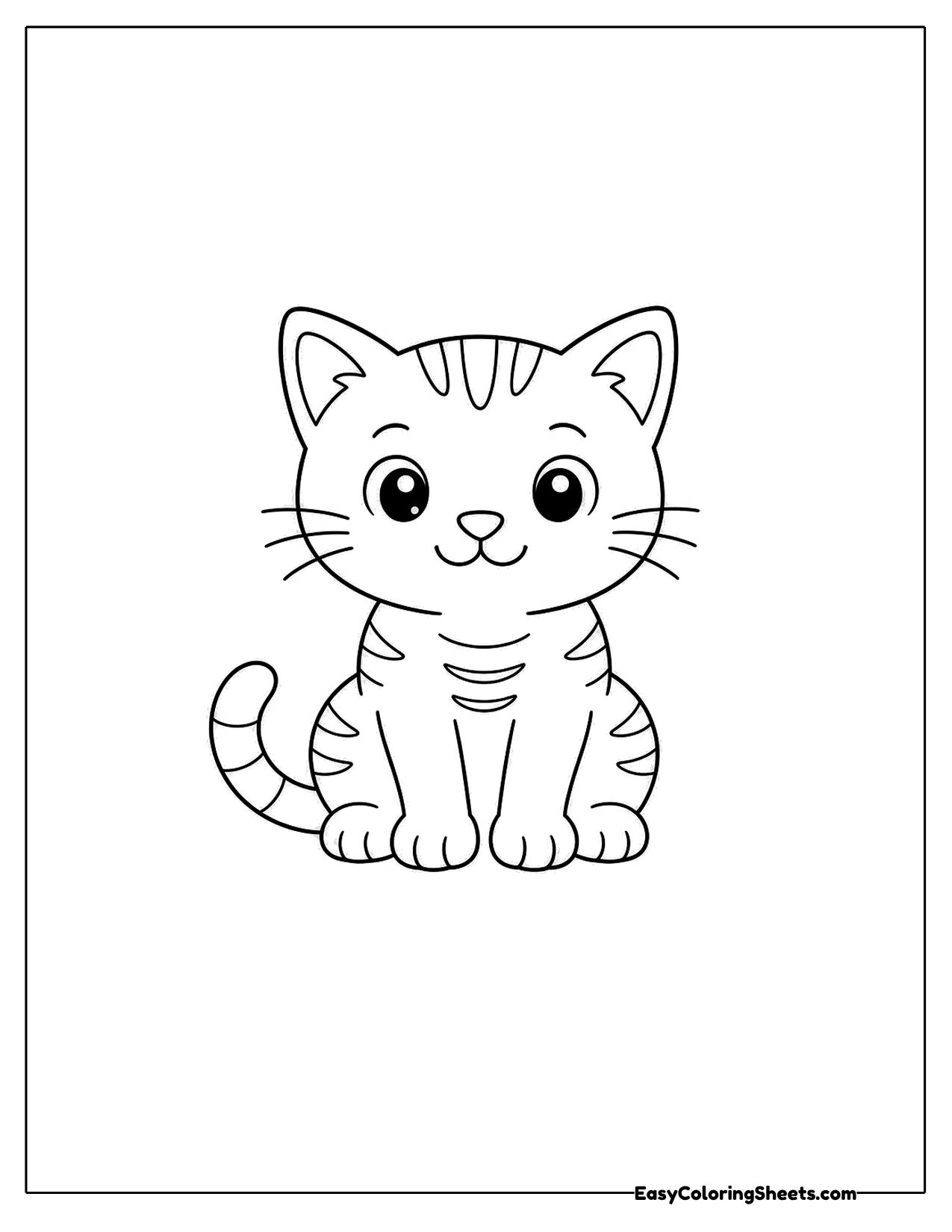 Striped kitten sitting and facing forward