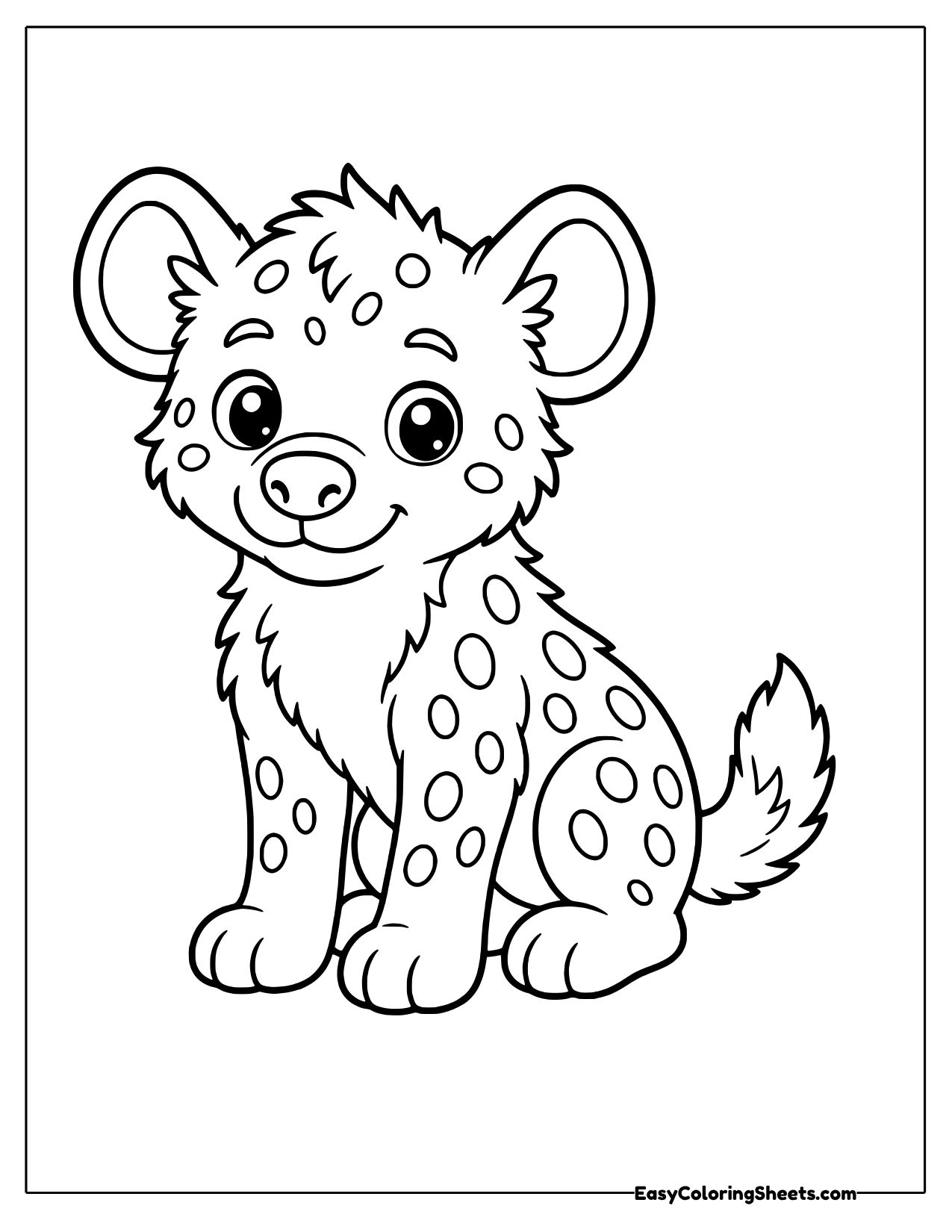 This spotted hyena cub sits with its ears perked and its head tilted, looking curious.