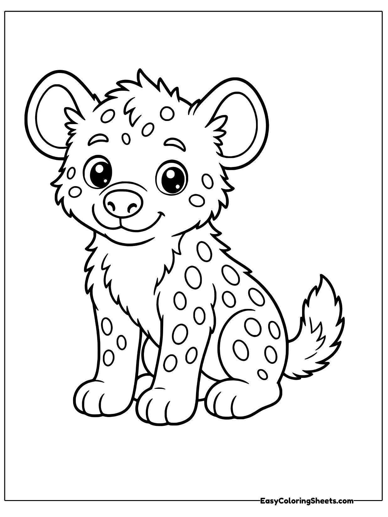 This spotted hyena cub sits with its ears perked and its head tilted, looking curious.