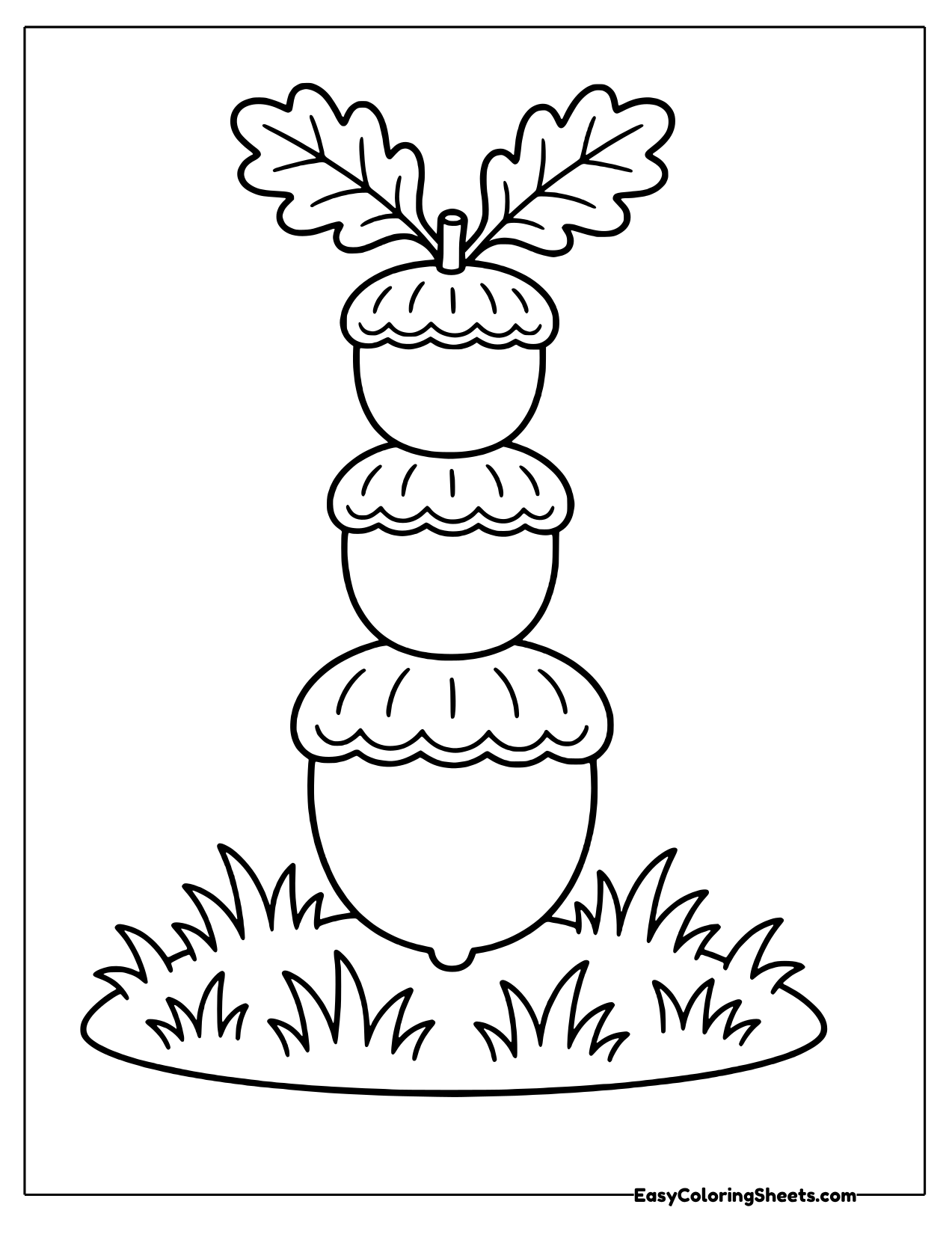 Three acorns stacked in a tower with leaves on top
